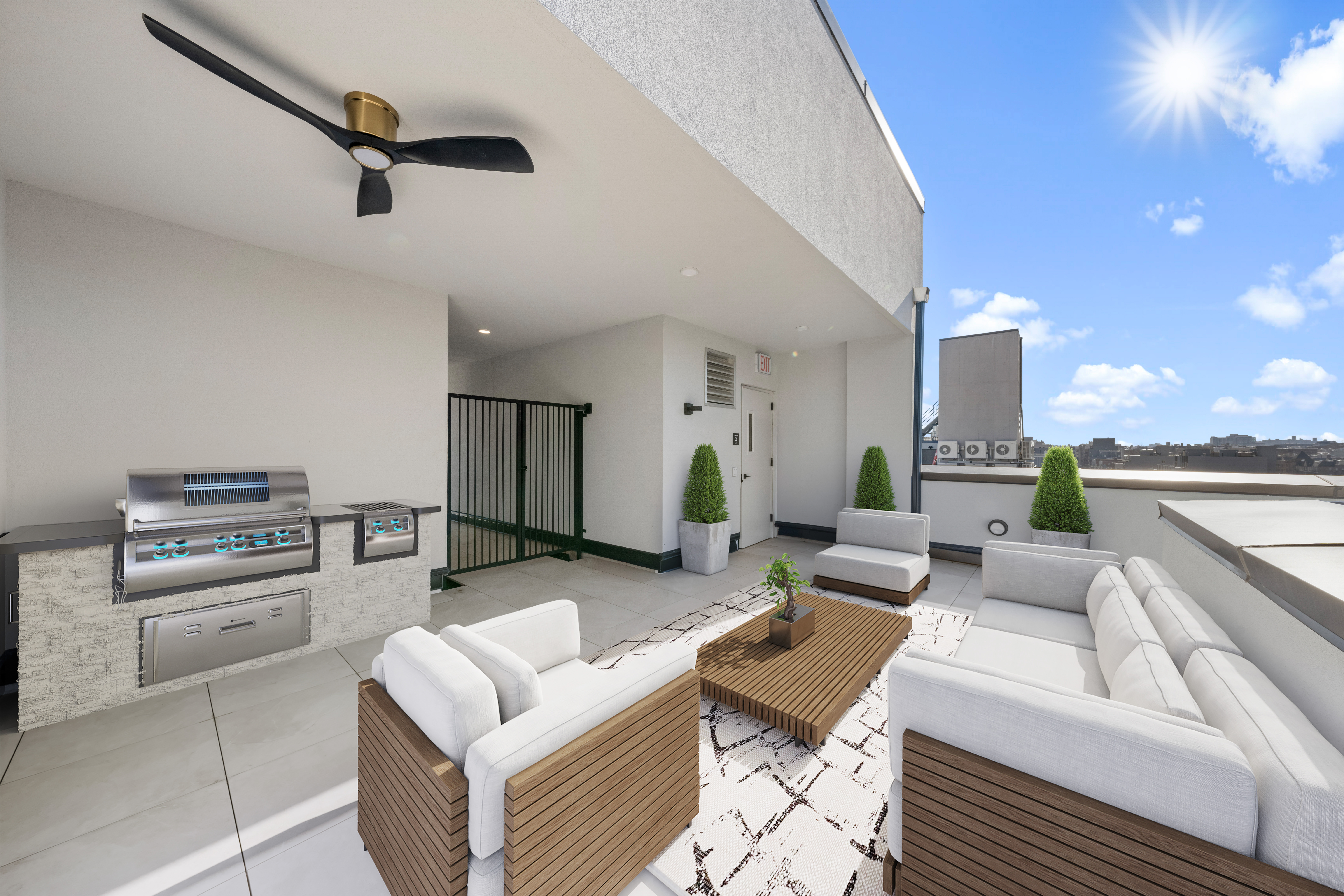 14-35 Broadway, Unit PH Queens, NY 11106 - Photo 23 of 24 a living room with furniture and a ceiling fan