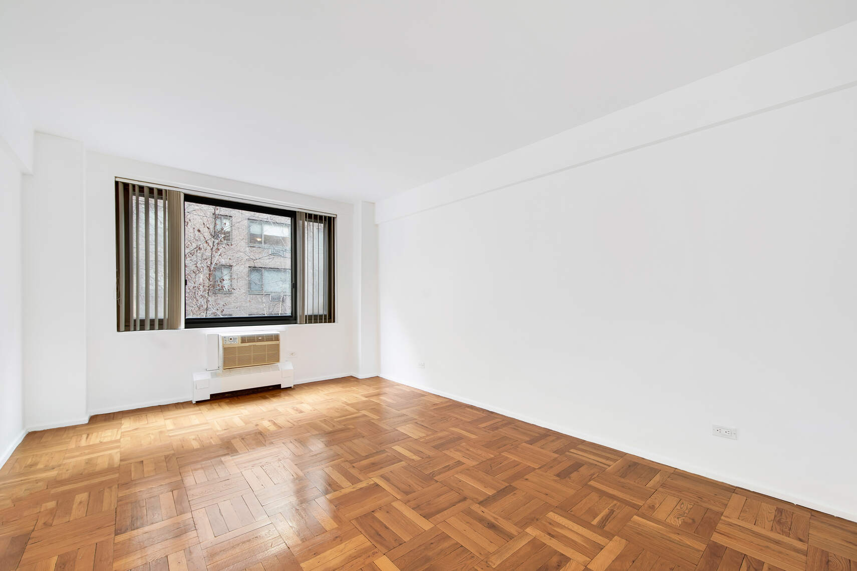 420 East 64th Street, Unit W4A Manhattan, NY 10065 - Photo 2 of 5 a view of empty room with window