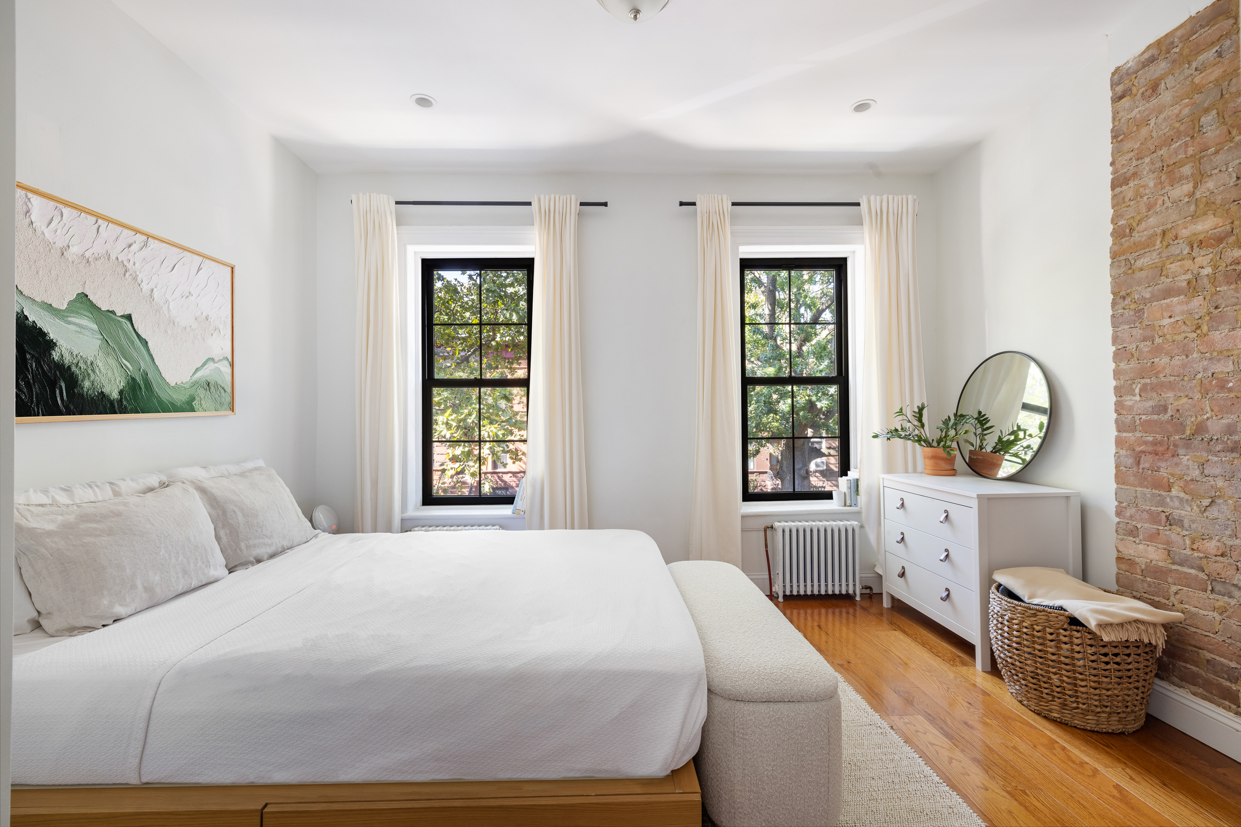 716 Monroe Street Brooklyn, NY 11221 - Photo 10 of 22 a bedroom with a large bed and windows