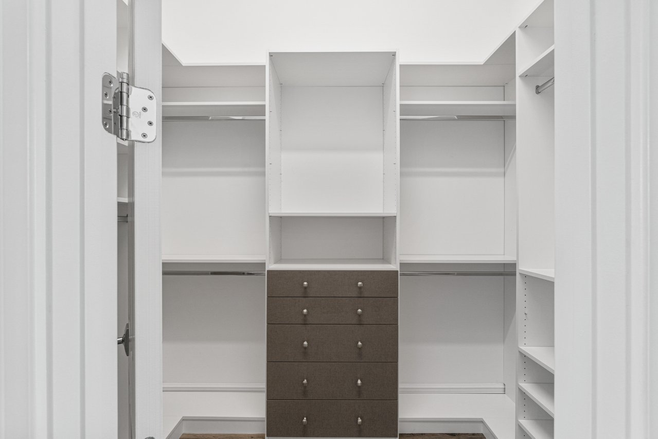 17352 Rosella Road Boca Raton, FL 33496 - Photo 16 of 41 a kitchen with cabinets and a closet