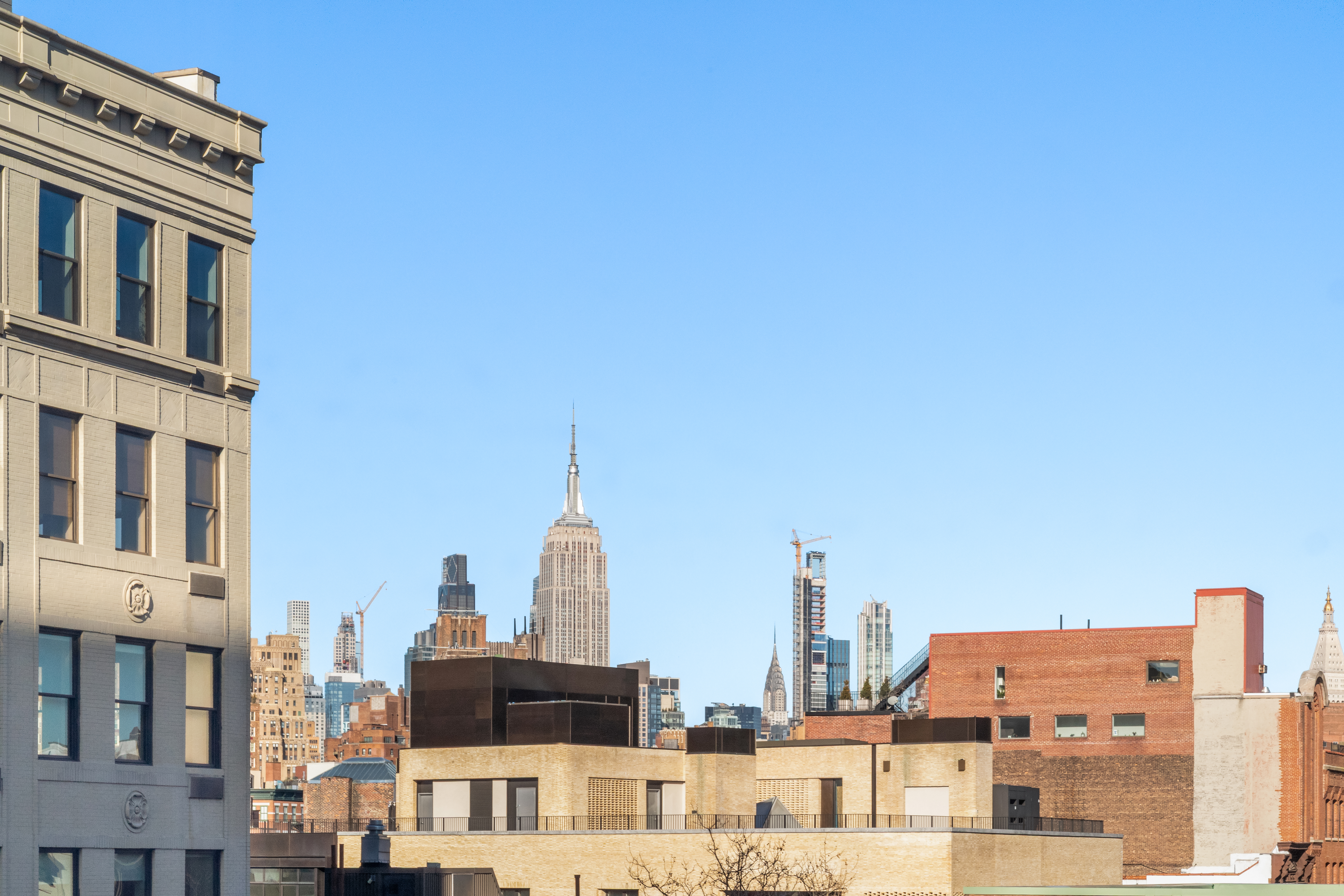 166 Perry Street, Unit 6B Manhattan, NY 10014 - Photo 4 of 17 a view of buildings