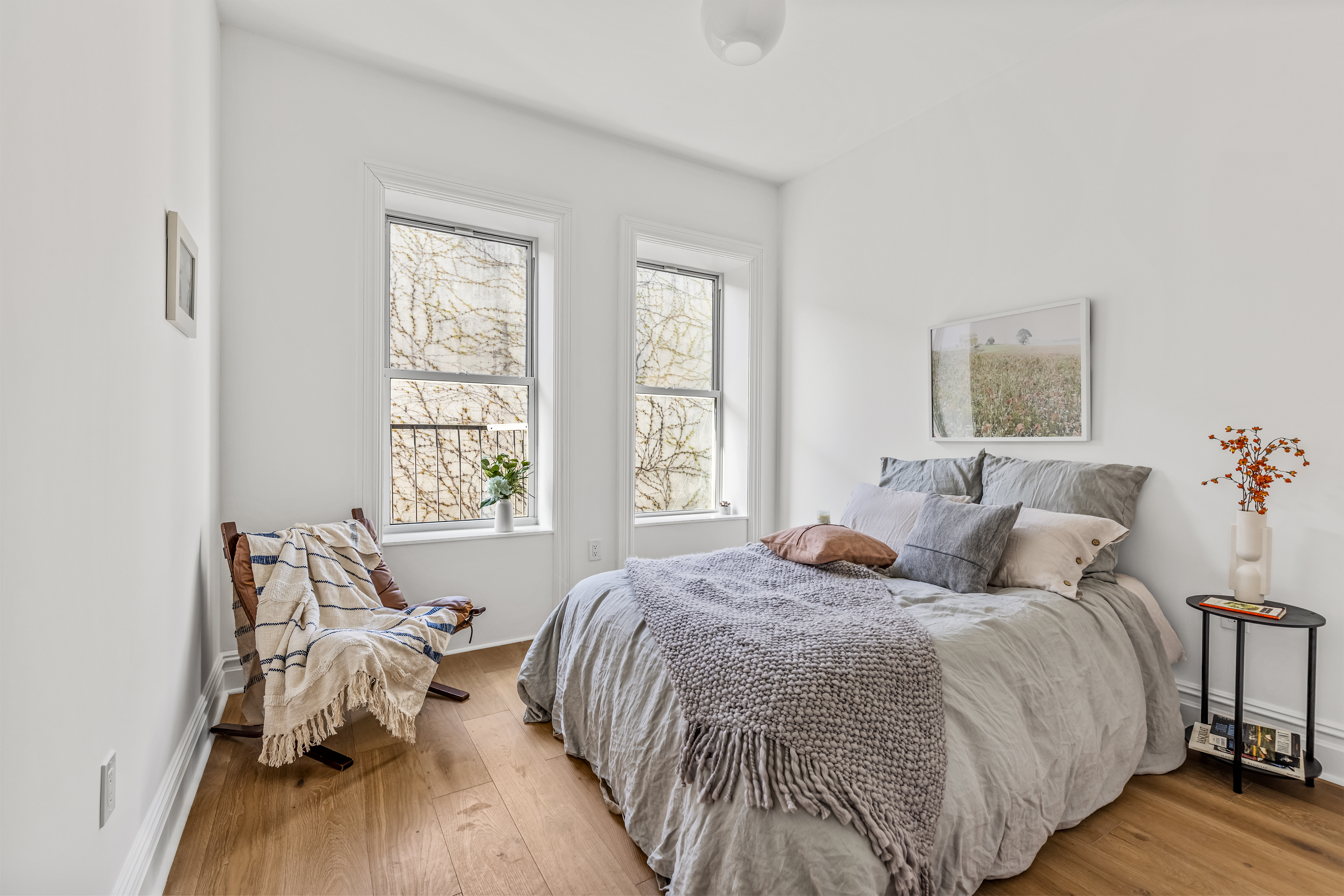 744 Park Place, Unit 4A Brooklyn, NY 11216 - Photo 10 of 13 a bedroom with a bed and wooden floor