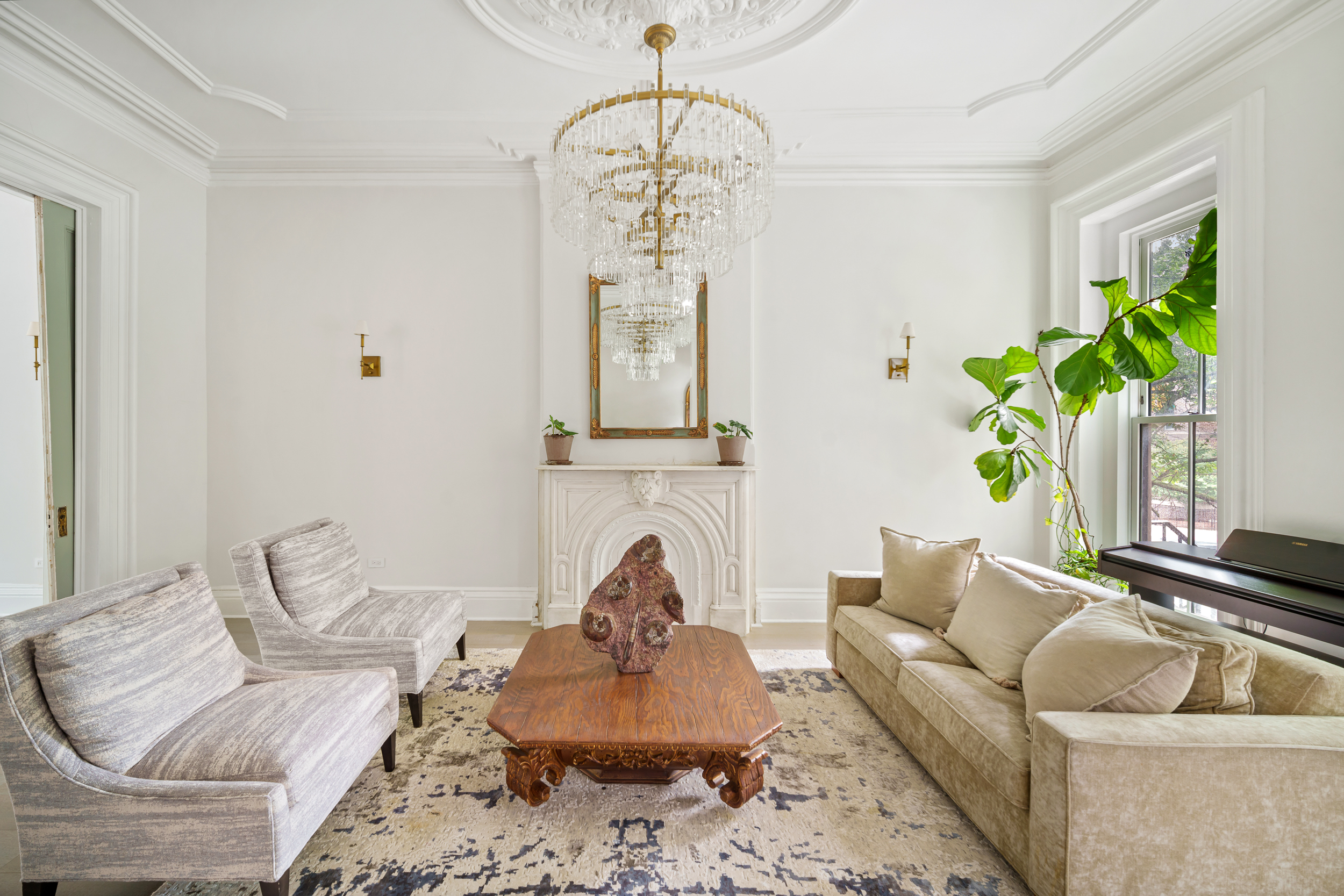265 6th Avenue Brooklyn, NY 11215 - Photo 3 of 24 a living room with furniture and a chandelier