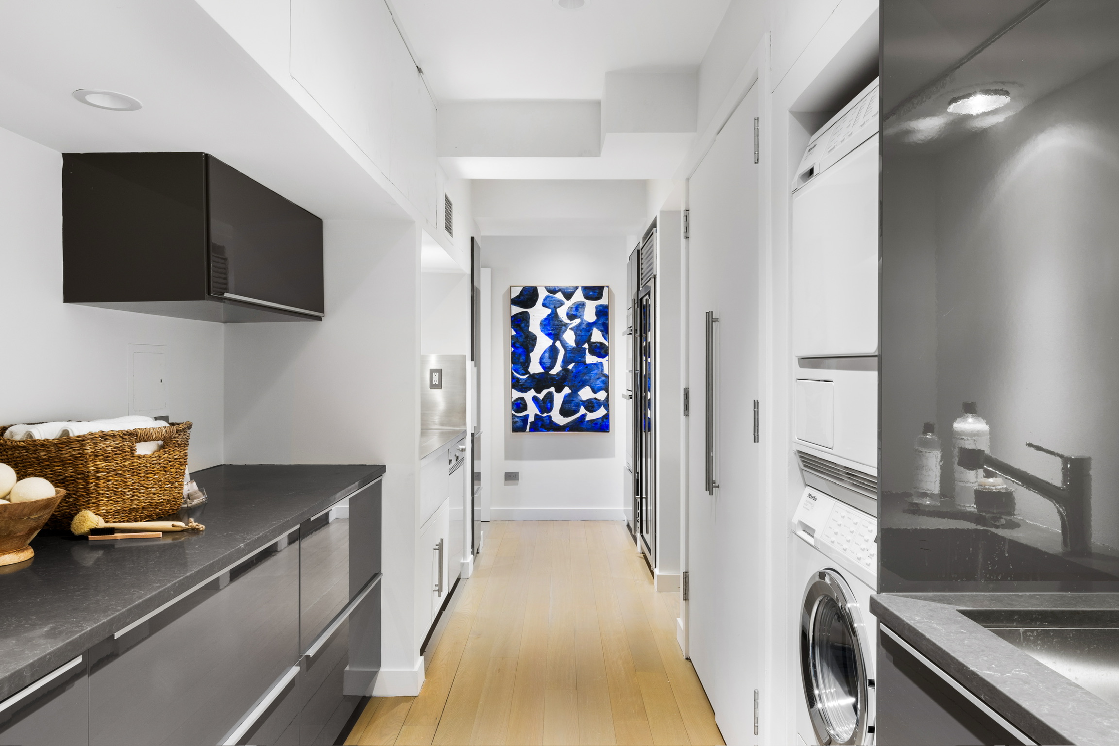 1200 Broadway, Unit PH89 Manhattan, NY 10001 - Photo 18 of 47 a view of a kitchen with fridge and sink