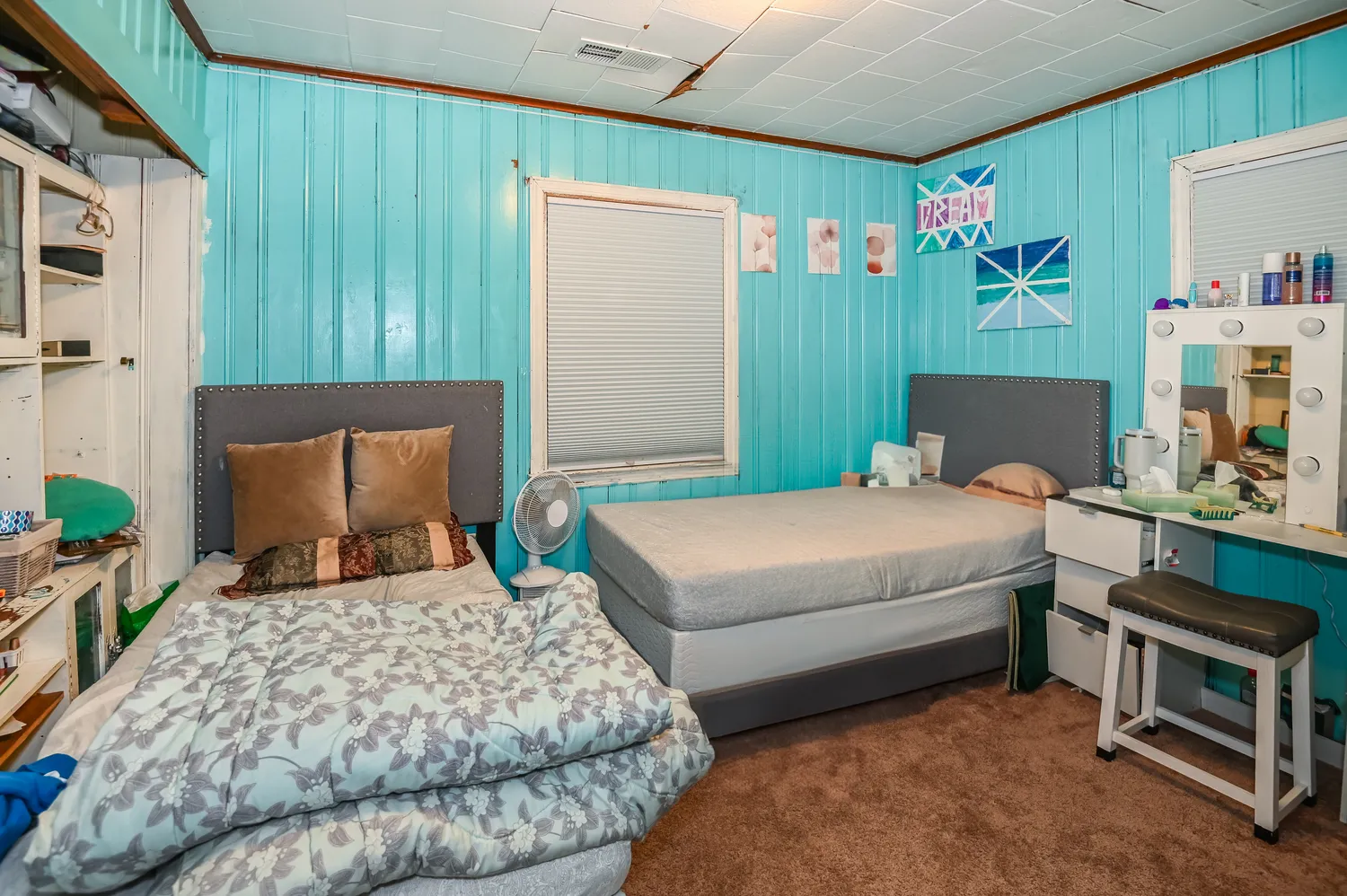 a bedroom with a bed and a couch