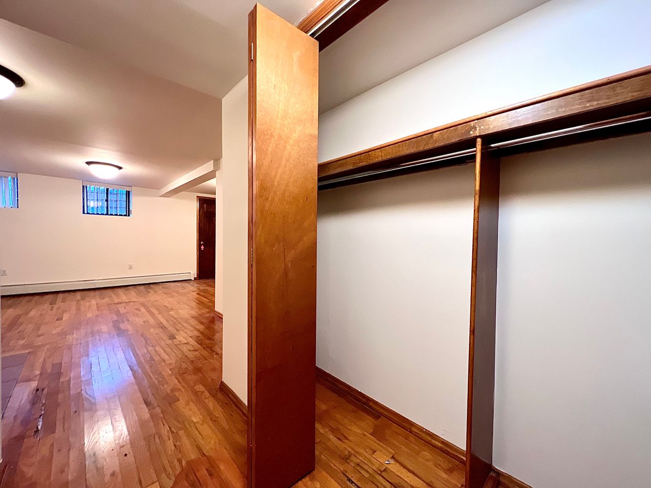 1561 Carroll Street, Unit Undisclosed Brooklyn, NY 11213 - Photo 8 of 9 a view of empty room with wooden floor