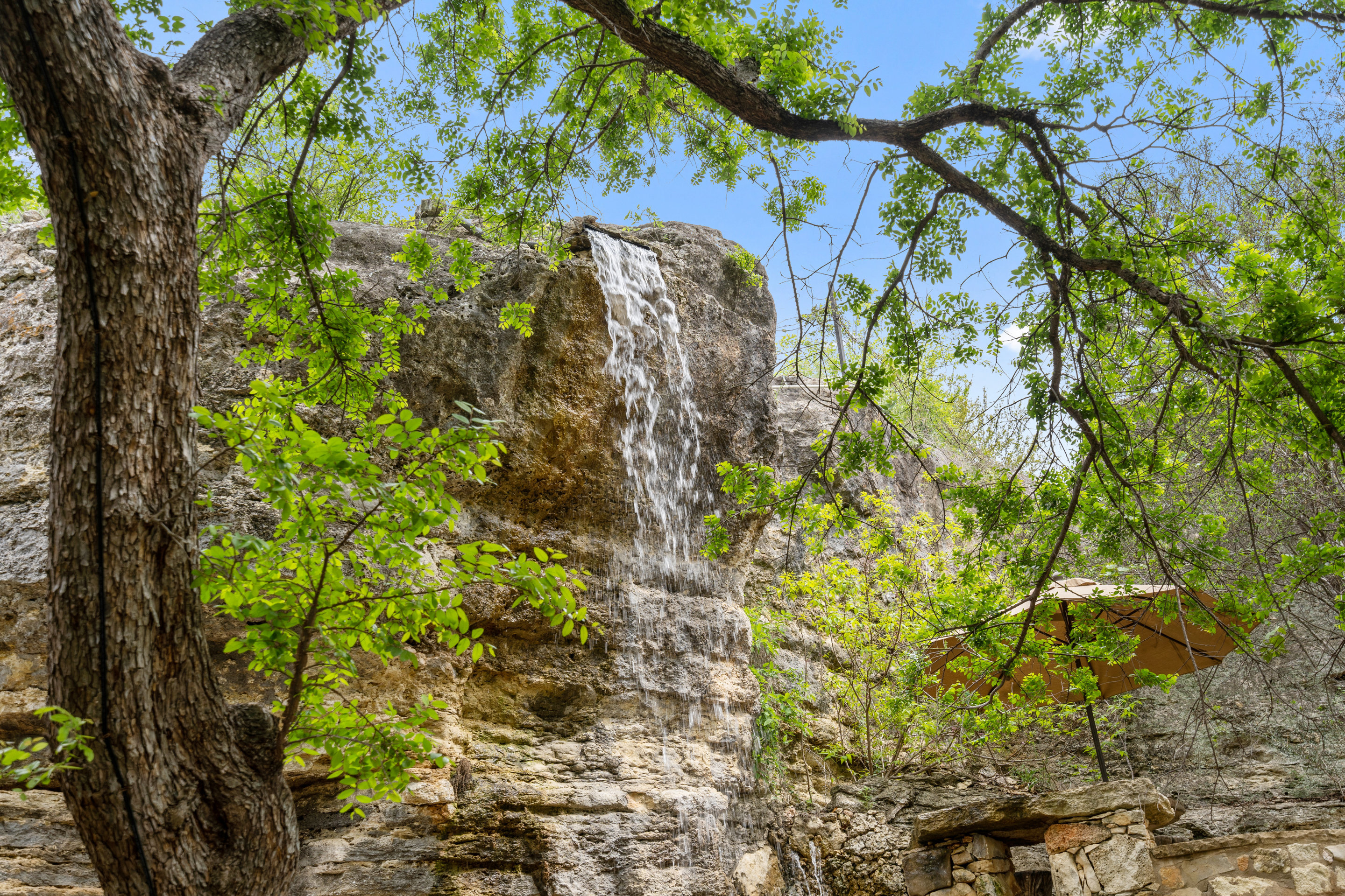 808 Rivercliff Drive Spicewood, TX 78669 - Photo 32 of 71 a backyard of a house with lots of green space