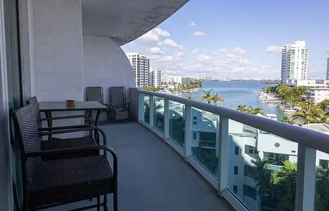 a view of a balcony with chairs