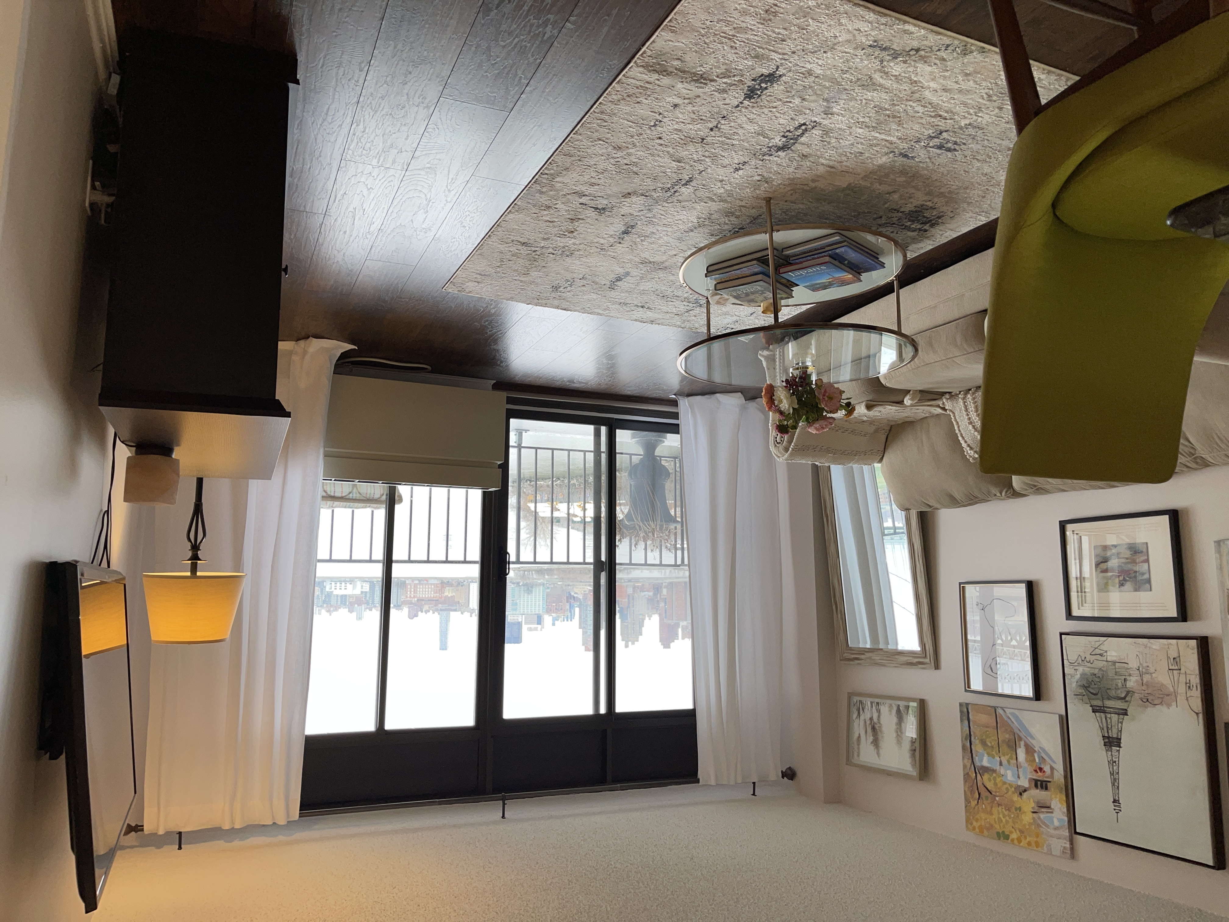 25-40 Shore Boulevard, Unit 8T Queens, NY 11102 - Photo 7 of 23 a living room with furniture and a lamp