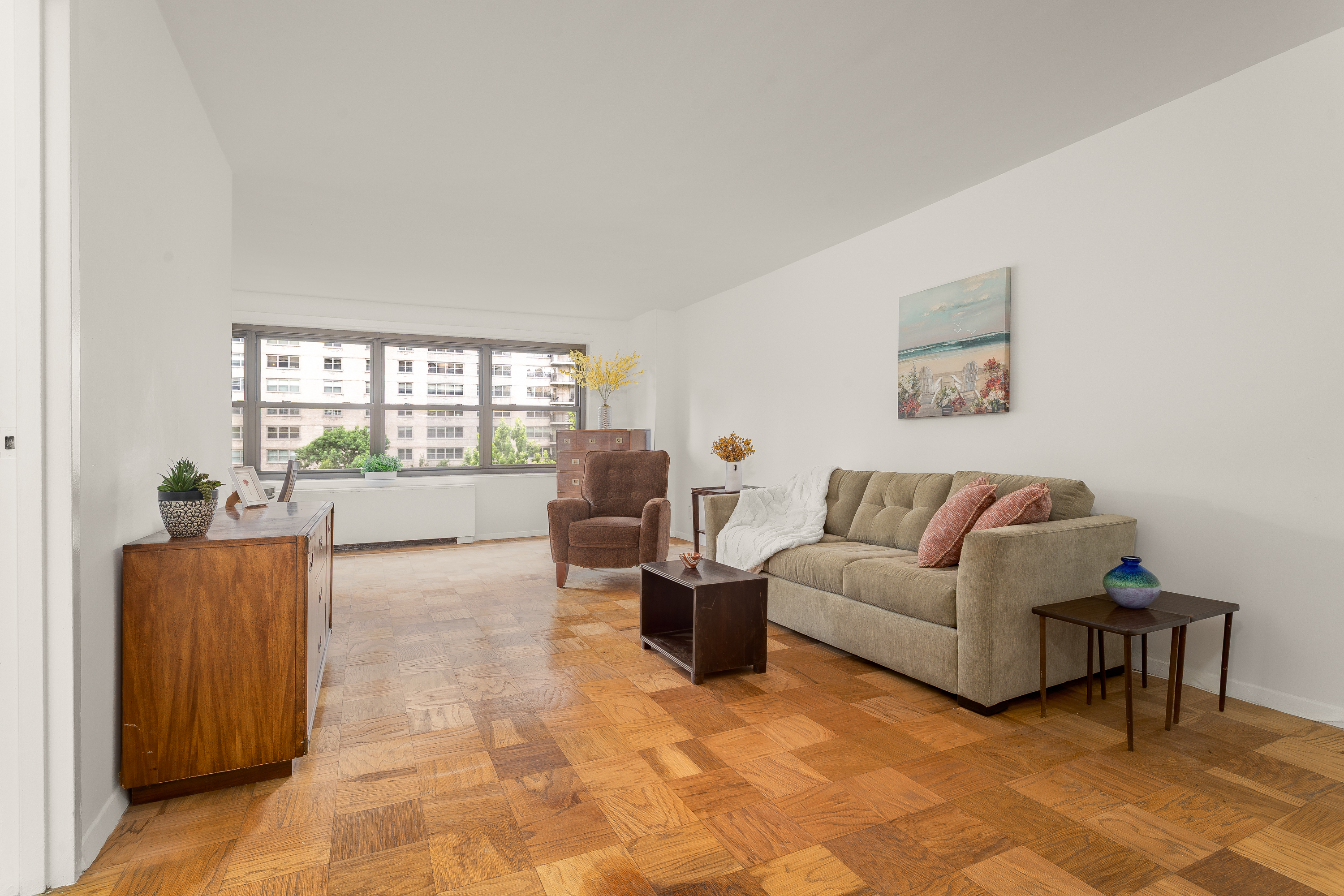 180 West End Avenue, Unit 5H Manhattan, NY 10023 - Photo 2 of 18 a living room with furniture and a large window