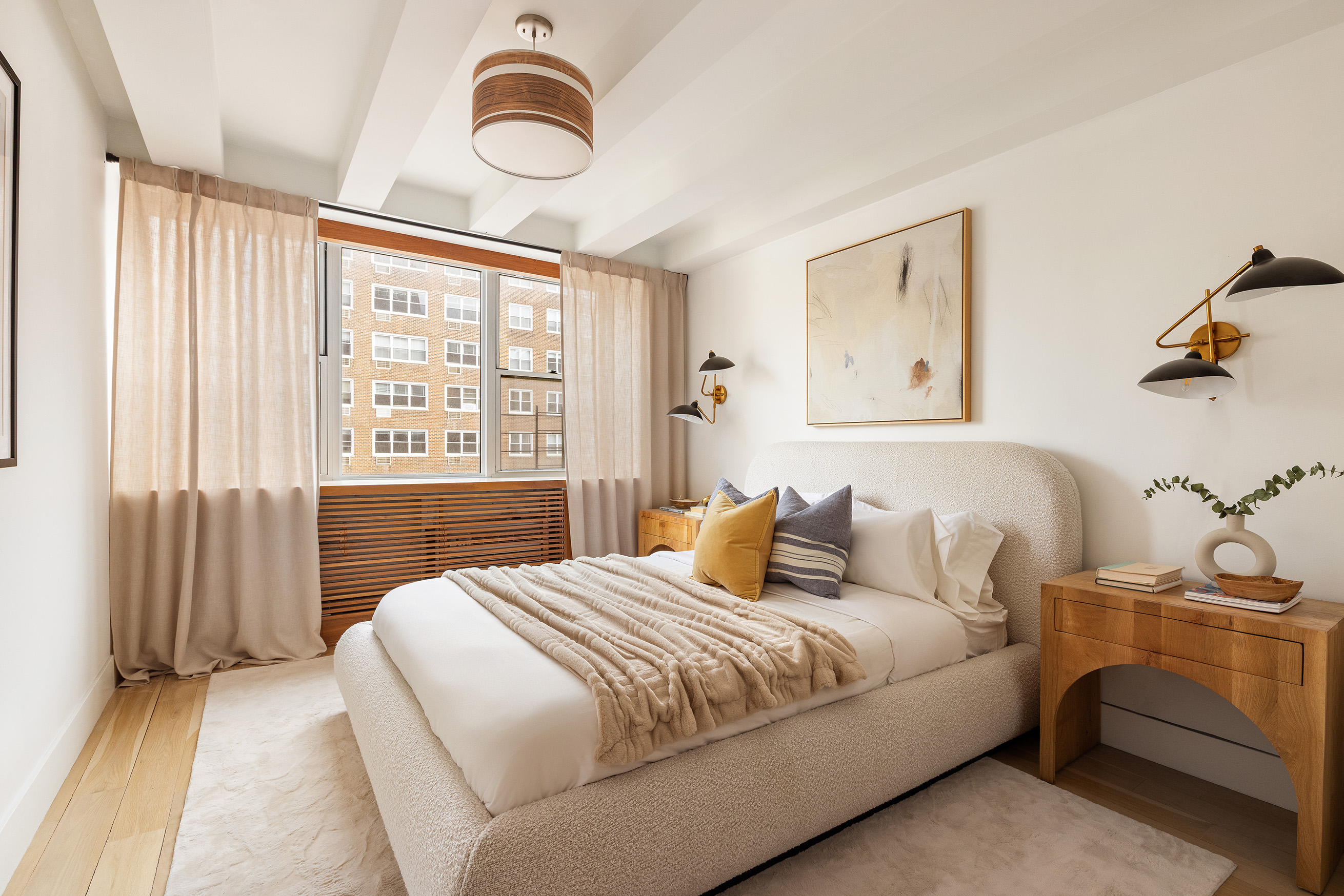 32 Gramercy Park South, Unit 12D Manhattan, NY 10003 - Photo 6 of 14 a bedroom with a large bed and a chandelier