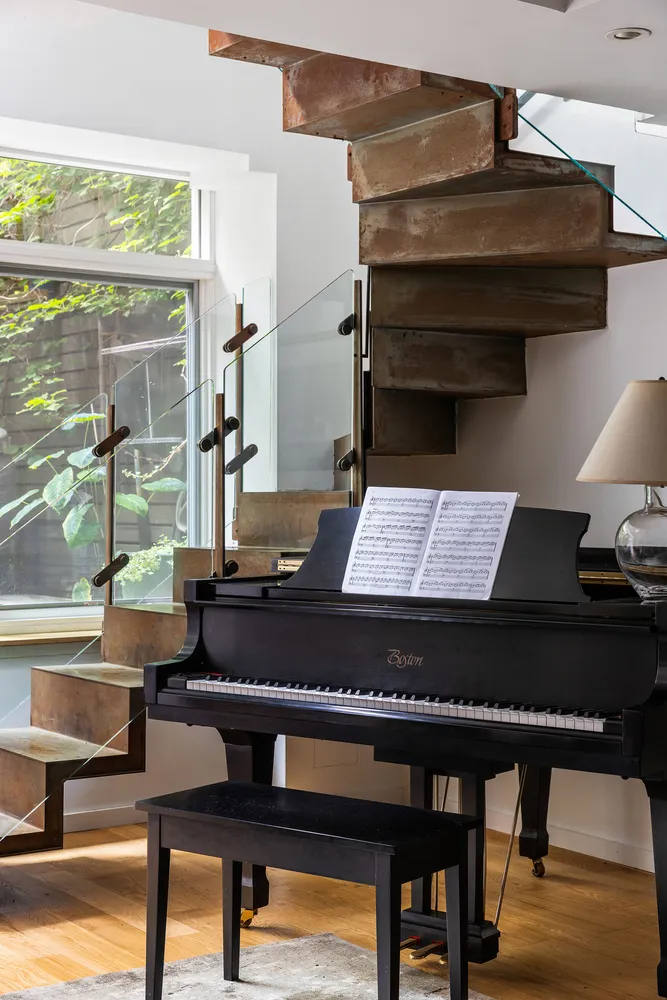 a living room with a table and a potted plant