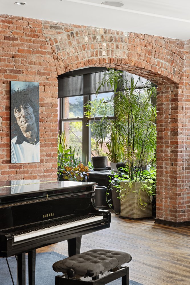 345 West 13th Street, Unit 2DEG Manhattan, NY 10014 - Photo 4 of 14 a kitchen with a wooden floor and a large window