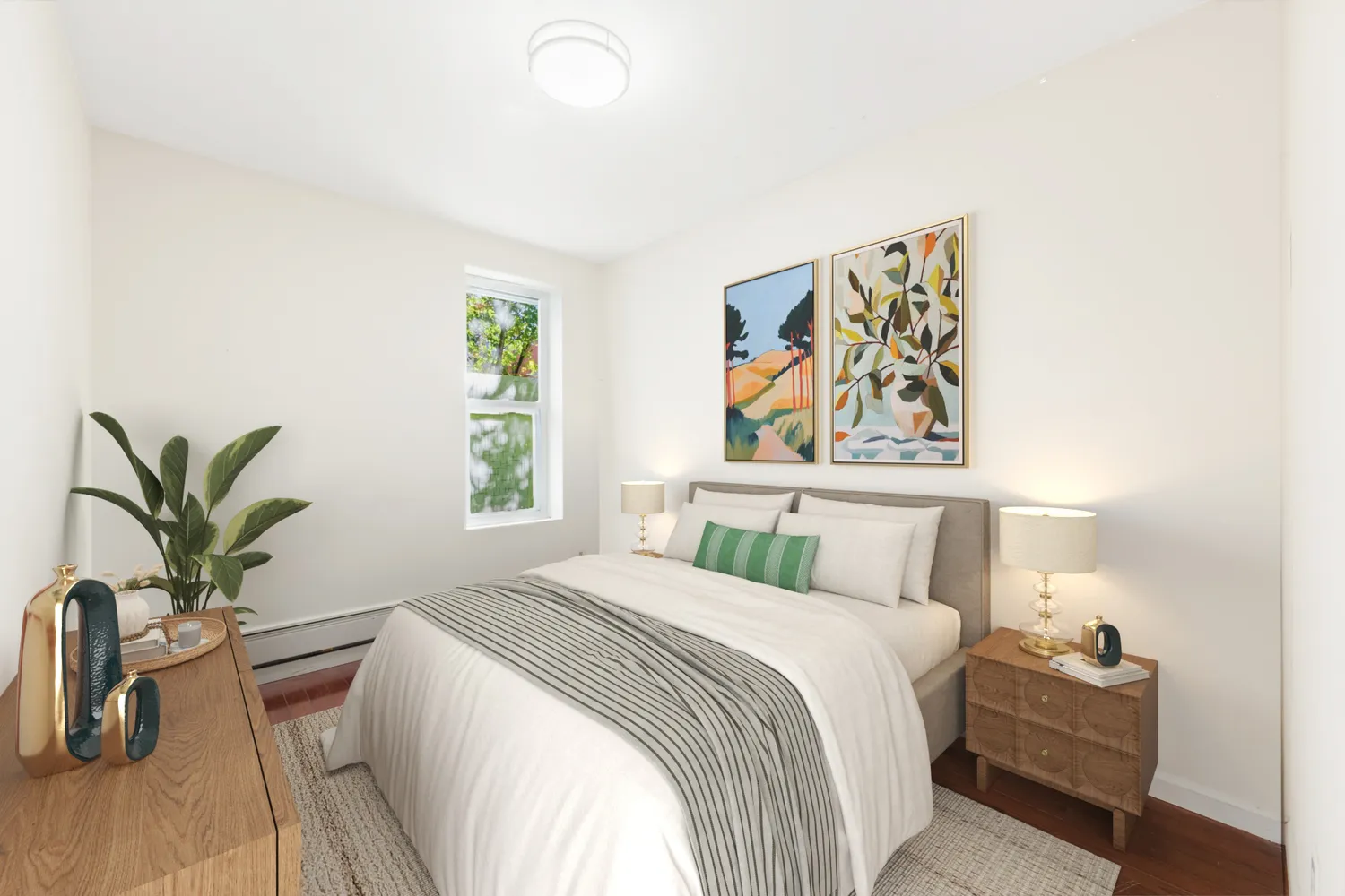 a bedroom with a large bed and a potted plant