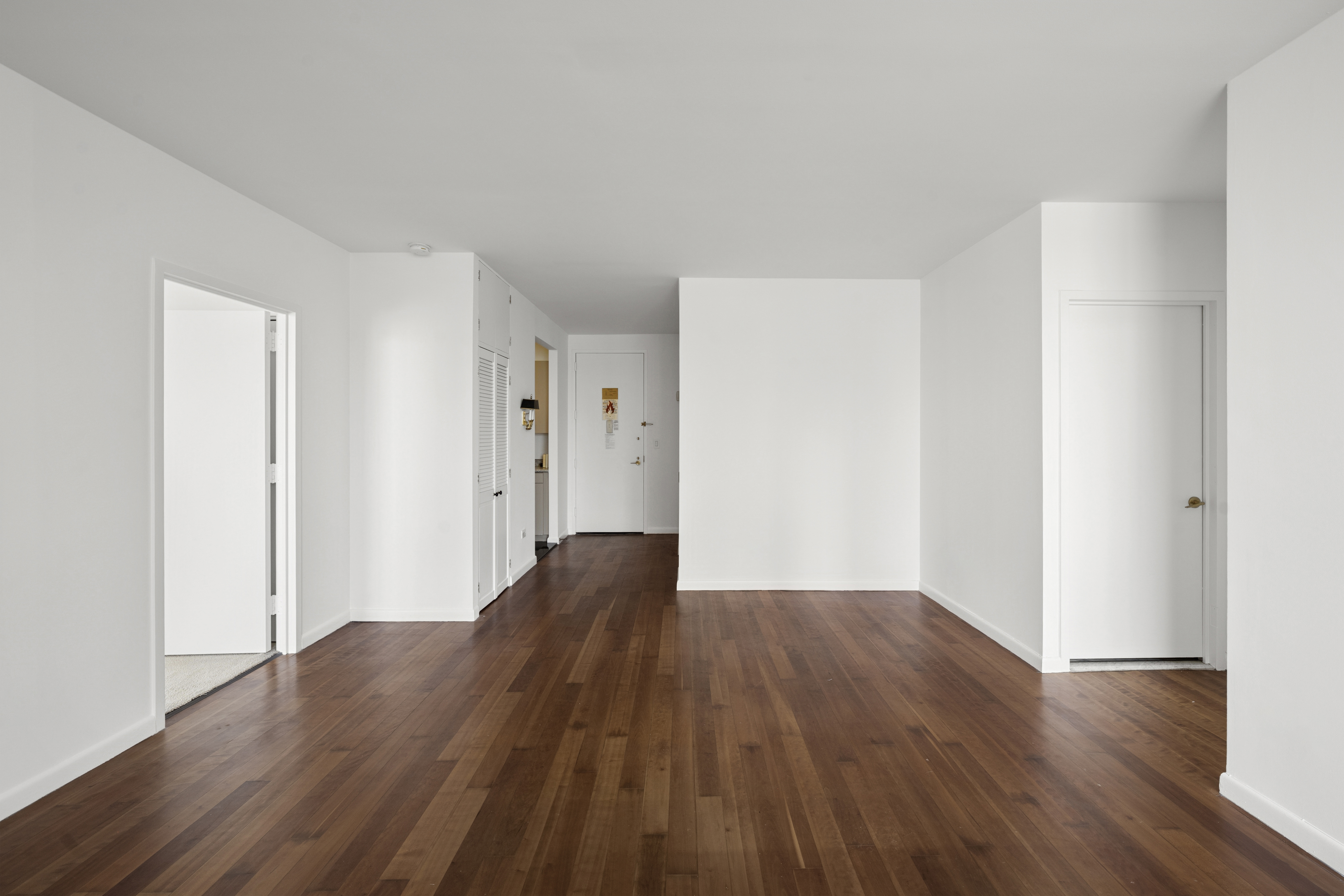 111 West 67th Street, Unit 22B Manhattan, NY 10023 - Photo 2 of 10 a view of wooden floor in an empty room