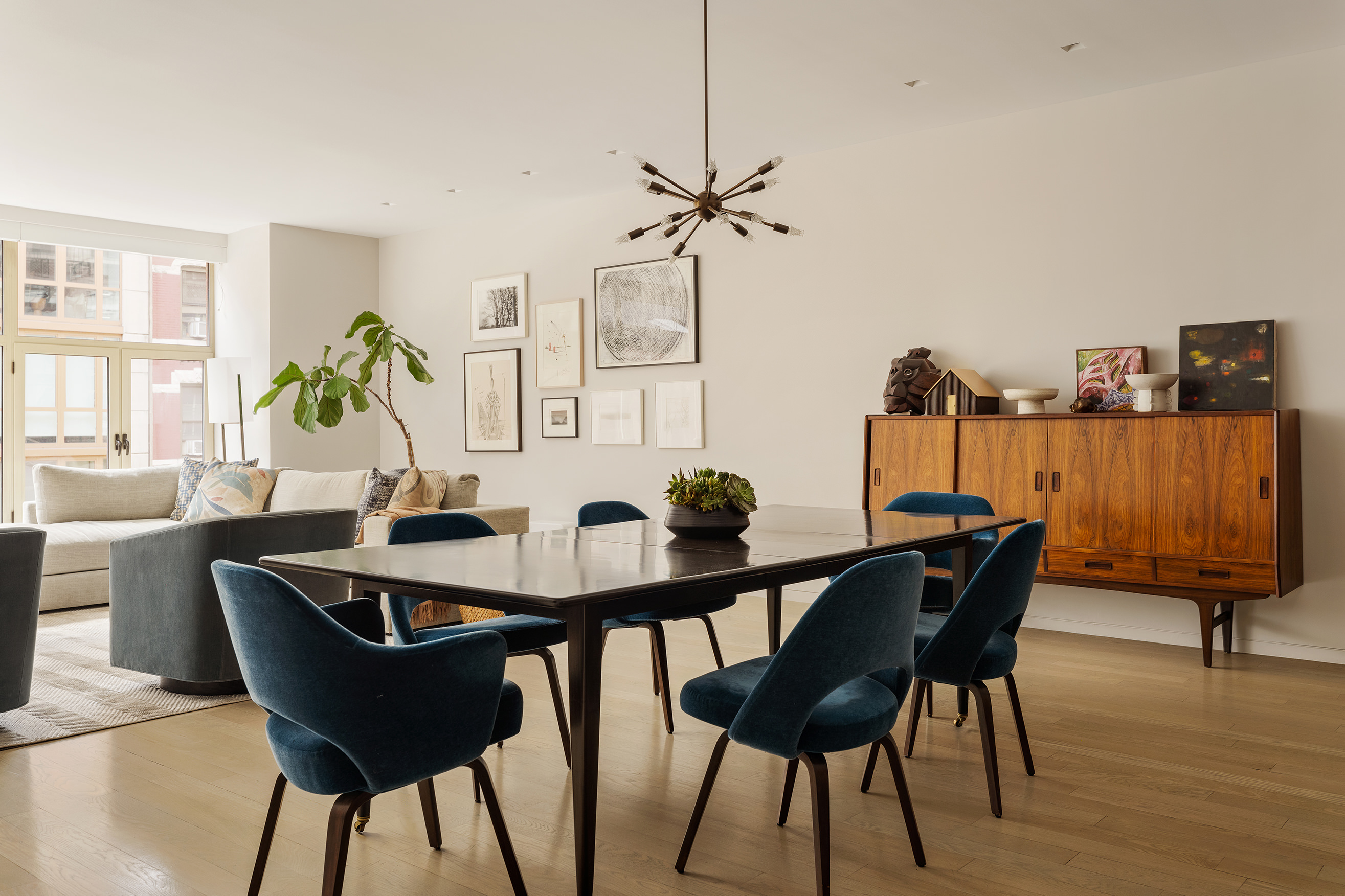 129 West 20th Street, Unit 4B Manhattan, NY 10011 - Photo 5 of 16 a view of a dining room with furniture and wooden floor
