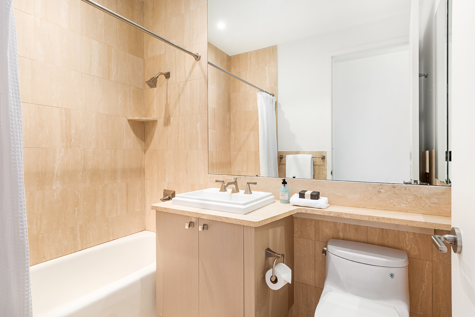 1 Central Park West, Unit 30E Manhattan, NY 10023 - Photo 9 of 12 a utility room with dryer and washer