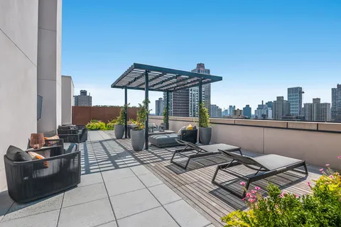 a view of a terrace with furniture