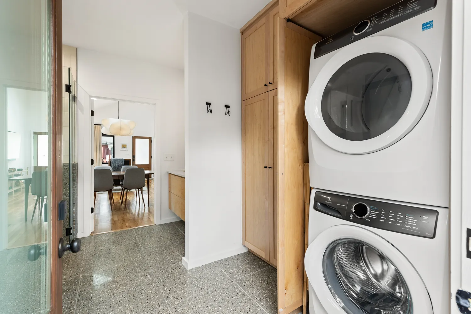 a view of a hallway with washer and dryer