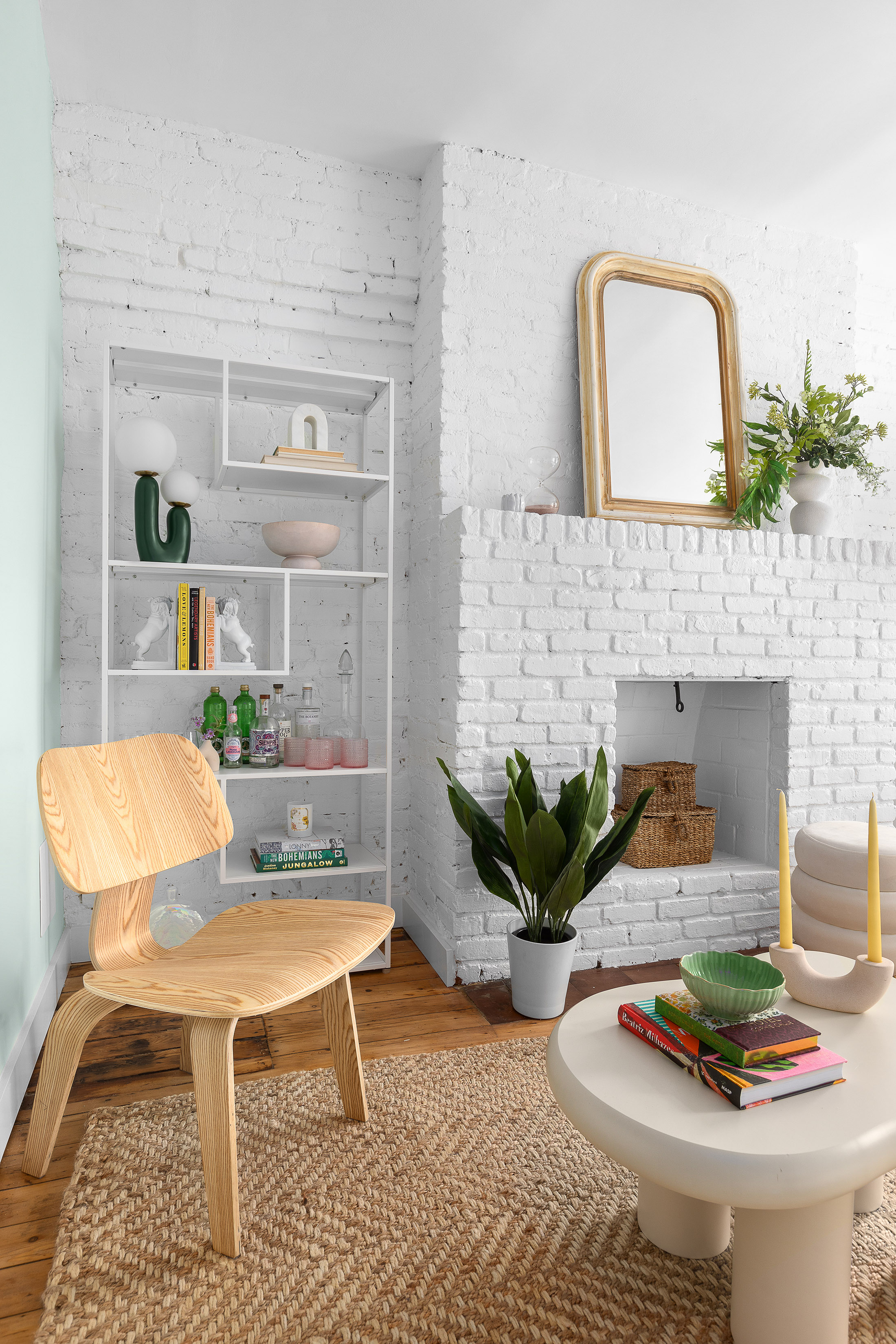 24 Cornelia Street, Unit 13 Manhattan, NY 10014 - Photo 3 of 12 a living room with furniture and a fireplace