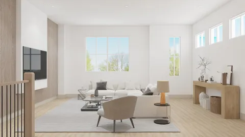 a living room with furniture a fireplace and a table