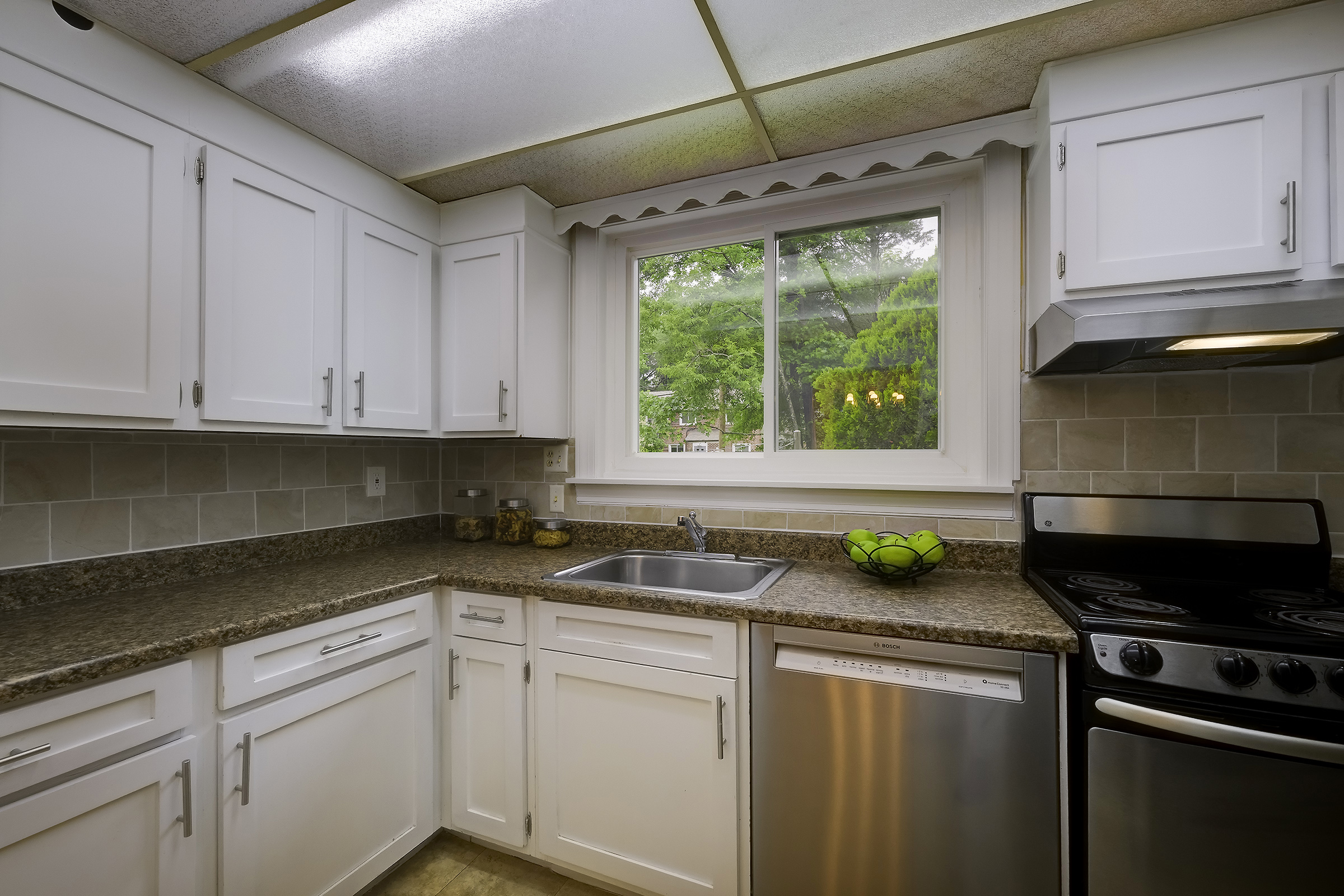45 D Ridge Road Greenbelt, MD 20770 - Photo 13 of 35 a kitchen with a sink and a stove