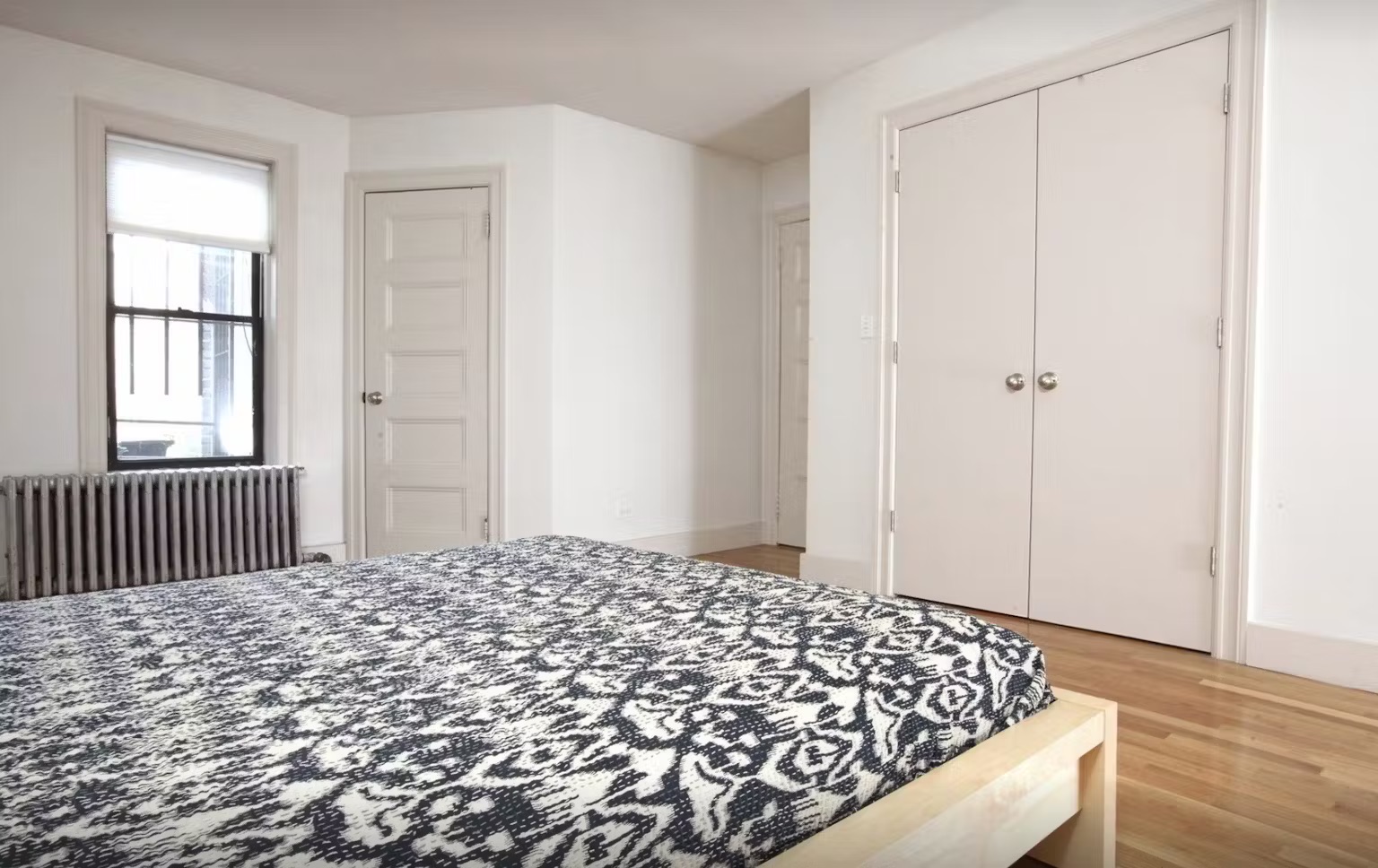 899 Lincoln Place, Unit 1 Brooklyn, NY 11213 - Photo 6 of 9 a bedroom with a bed and a window