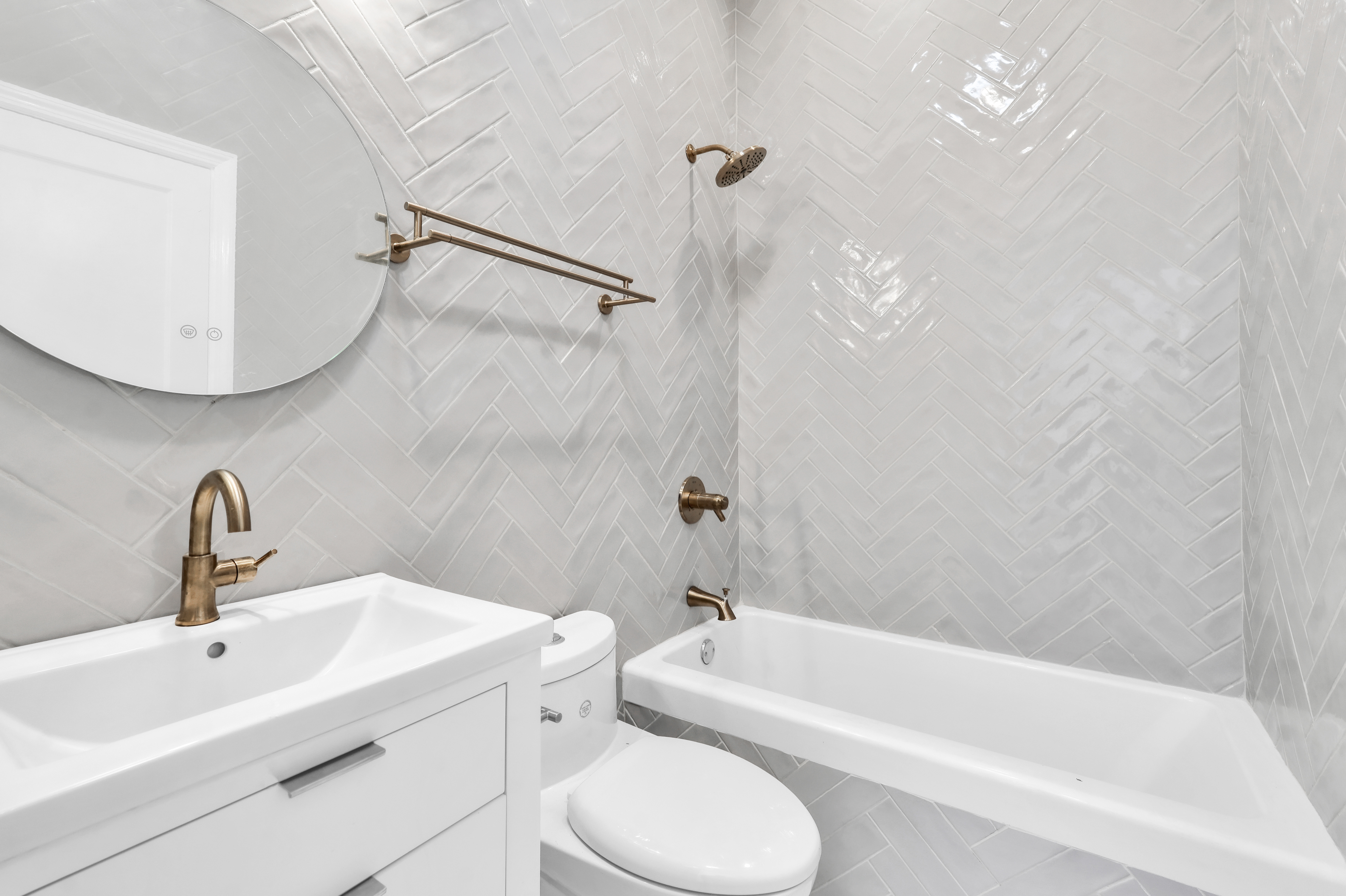 473 Monroe Street Brooklyn, NY 11221 - Photo 19 of 40 a bathroom with a sink toilet and bathtub