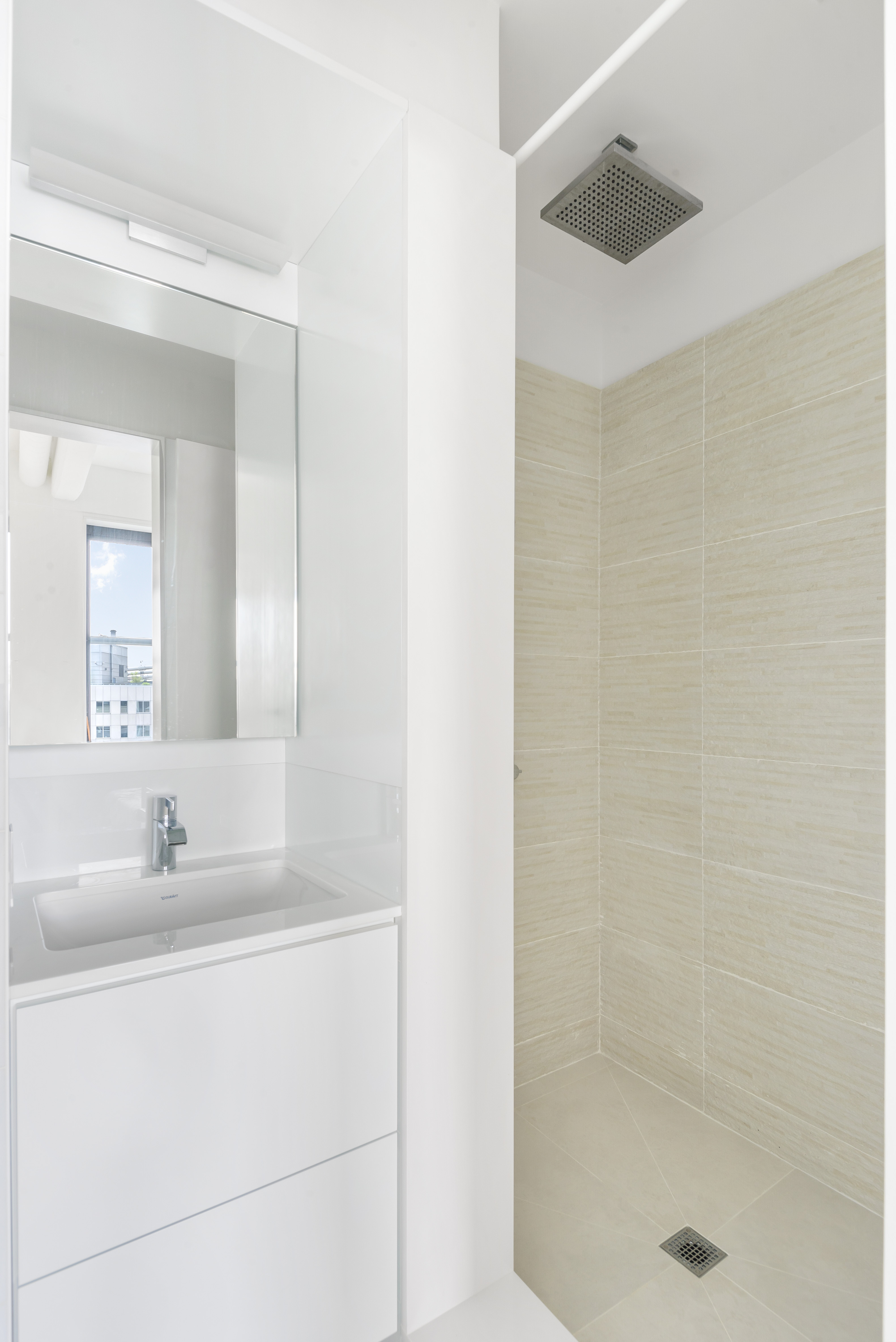 1 Main Street, Unit 9H Brooklyn, NY 11201 - Photo 10 of 15 a bathroom with a sink and a mirror