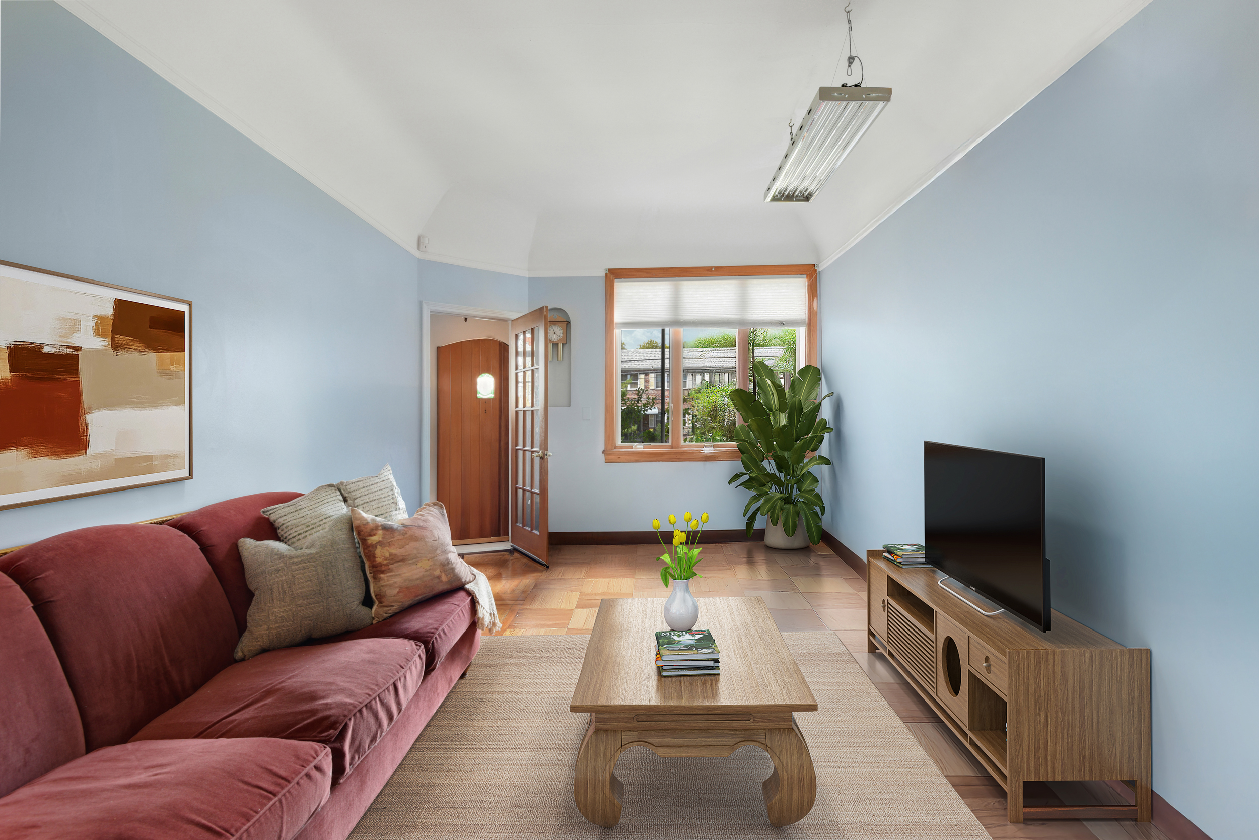 a living room with furniture and a flat screen tv