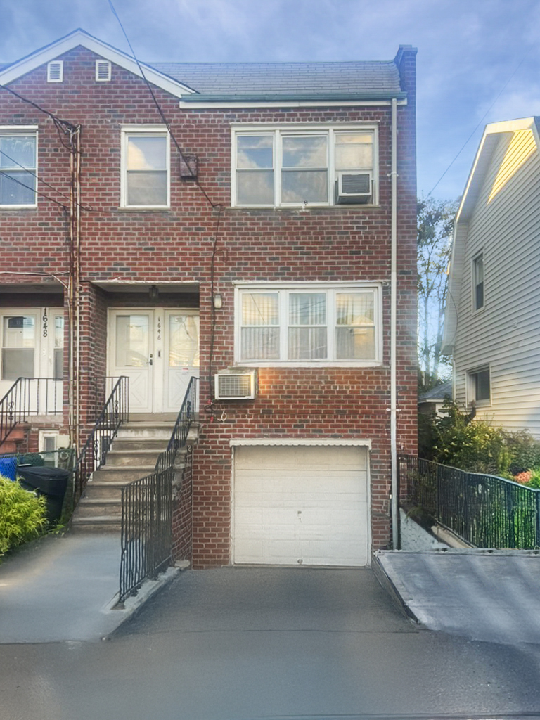 1646 East 51st Street Brooklyn, NY 11234 - Photo 1 of 2 front view of a house with a street