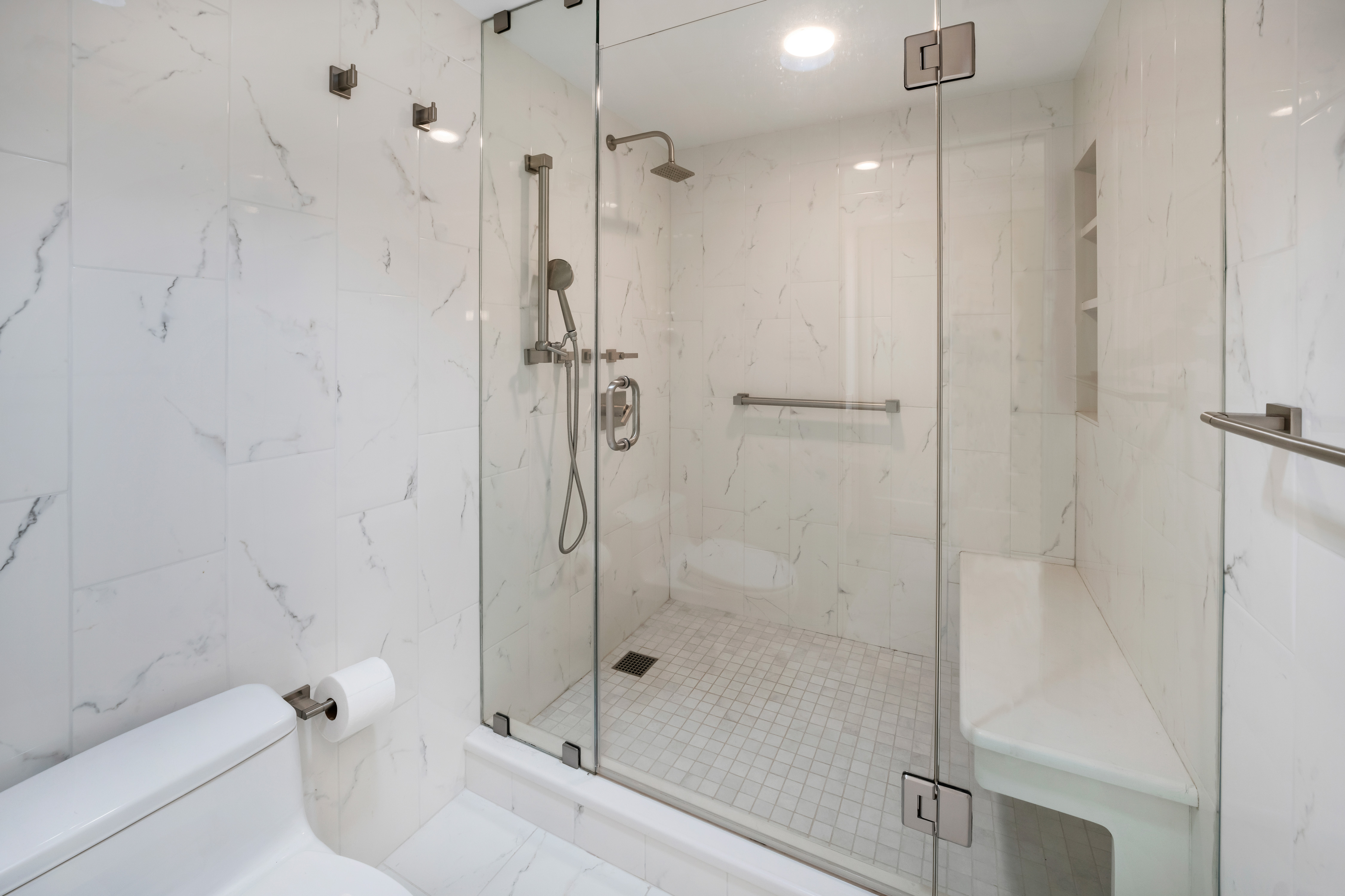 45 Sutton Place South, Unit 8L Manhattan, NY 10022 - Photo 11 of 22 a bathroom with a shower and a toilet