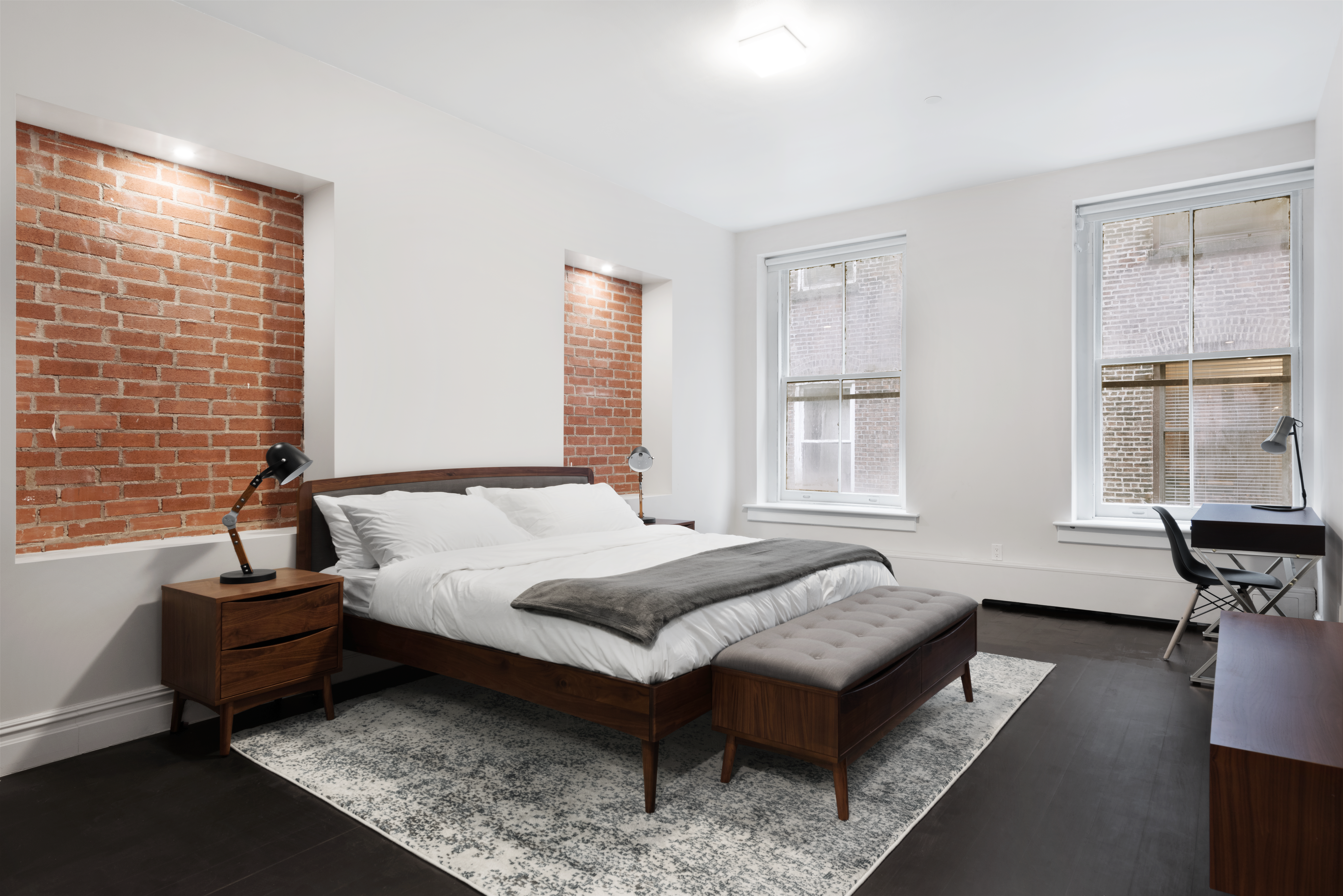175 Franklin Street, Unit 3 Manhattan, NY 10013 - Photo 4 of 11 a spacious bedroom with a bed and glass window