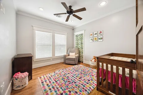 a bedroom with furniture and a window