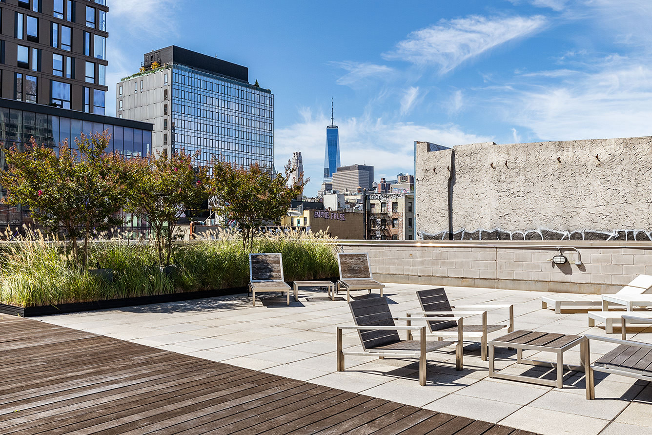 105 Norfolk Street, Unit 6A Manhattan, NY 10002 - Photo 9 of 11 a swimming pool with outdoor seating and yard