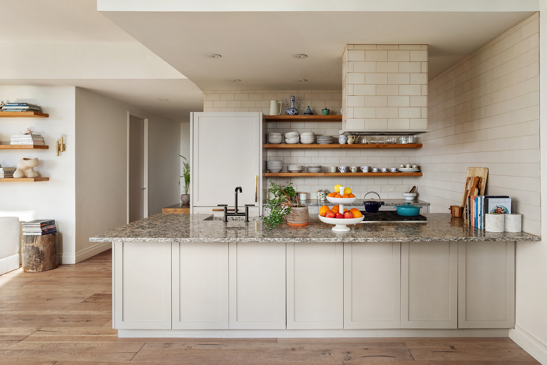 101 Warren Street, Unit 2010 Manhattan, NY 10007 - Photo 7 of 18 a kitchen with stainless steel appliances granite countertop a sink and a white cabinets