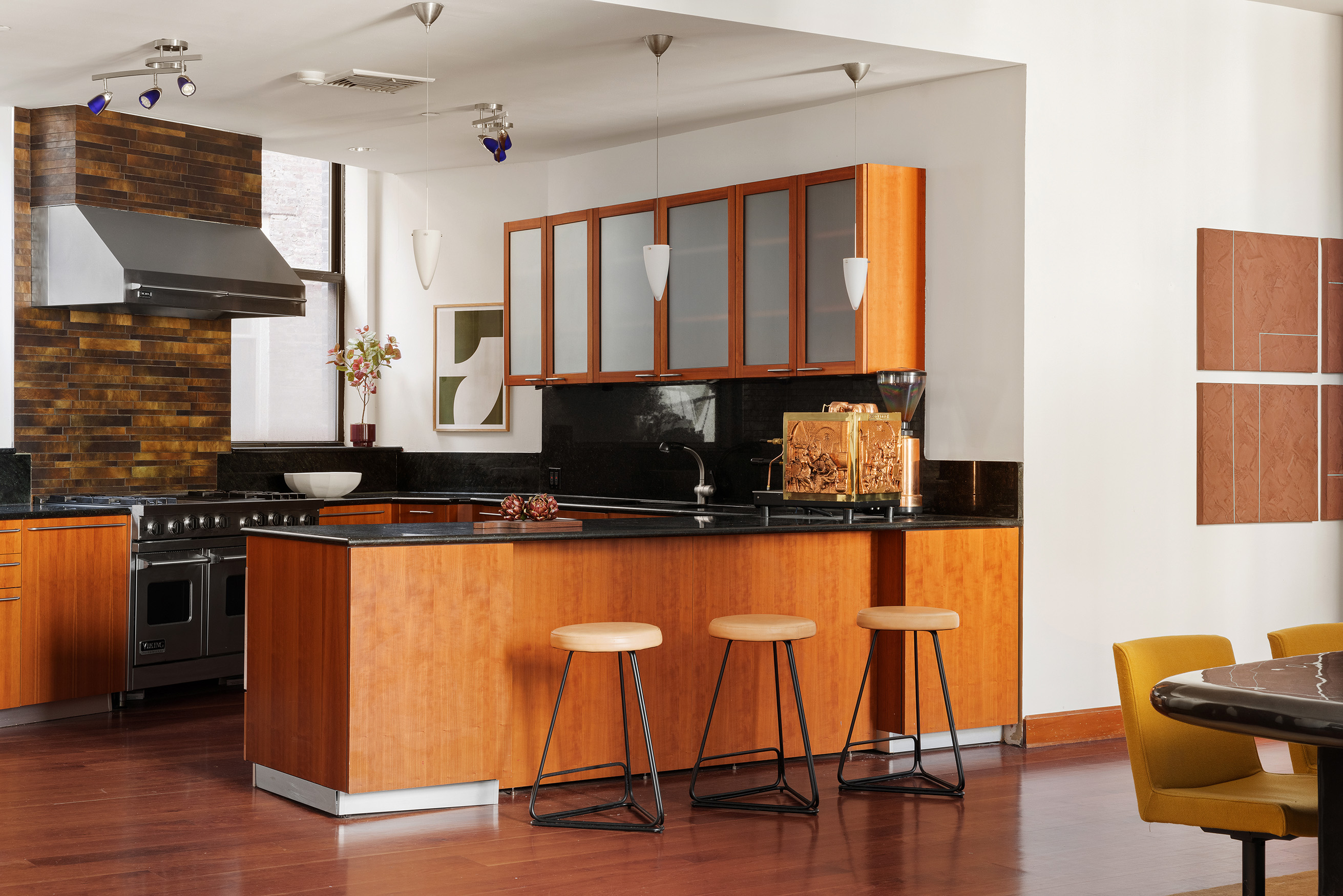 40 West 13th Street, Unit 2 Manhattan, NY 10011 - Photo 3 of 14 a kitchen with a table chairs in it and wooden floors