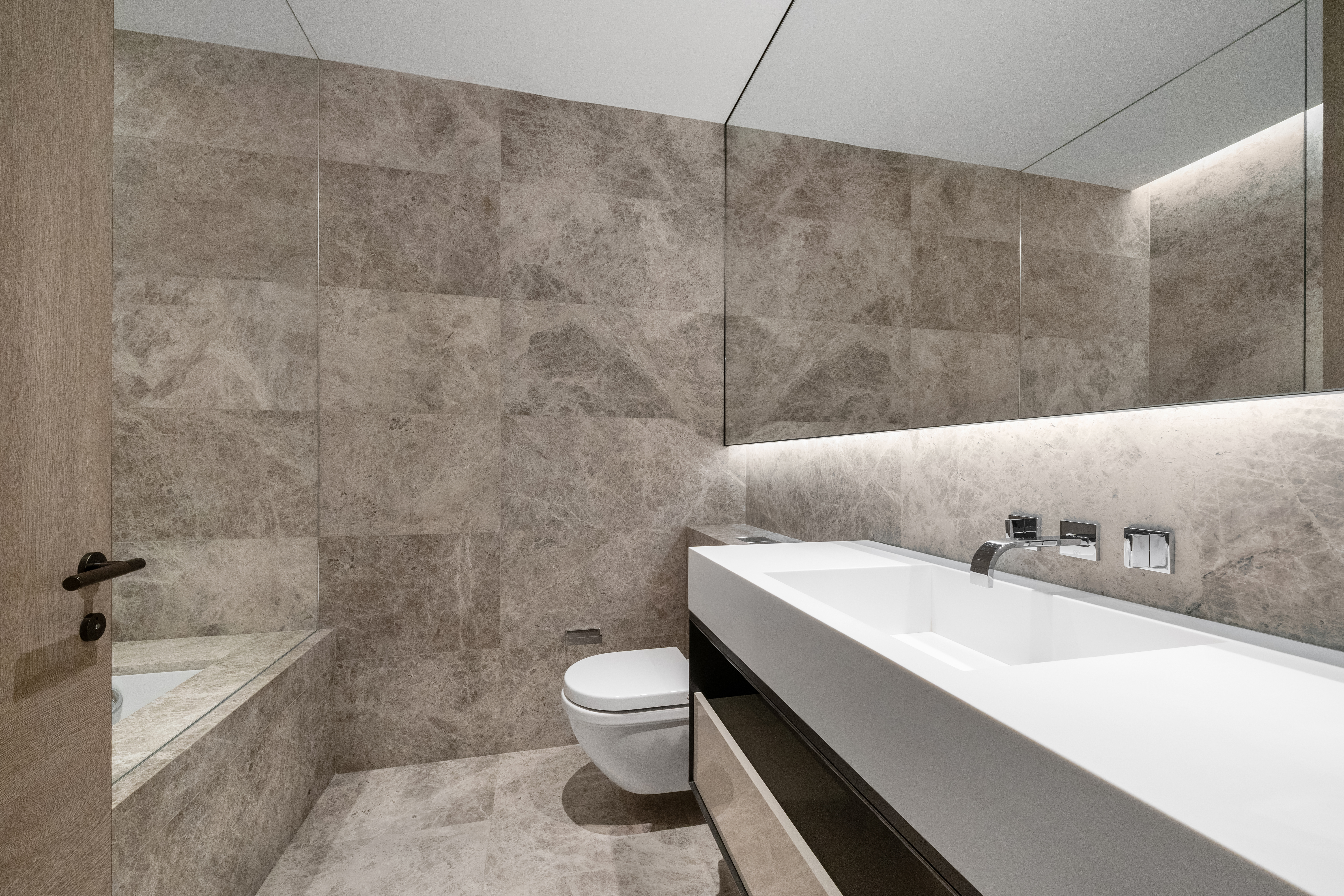 522 West 29th Street, Unit 7D Manhattan, NY 10001 - Photo 12 of 17 a bathroom with a sink a toilet and bathtub