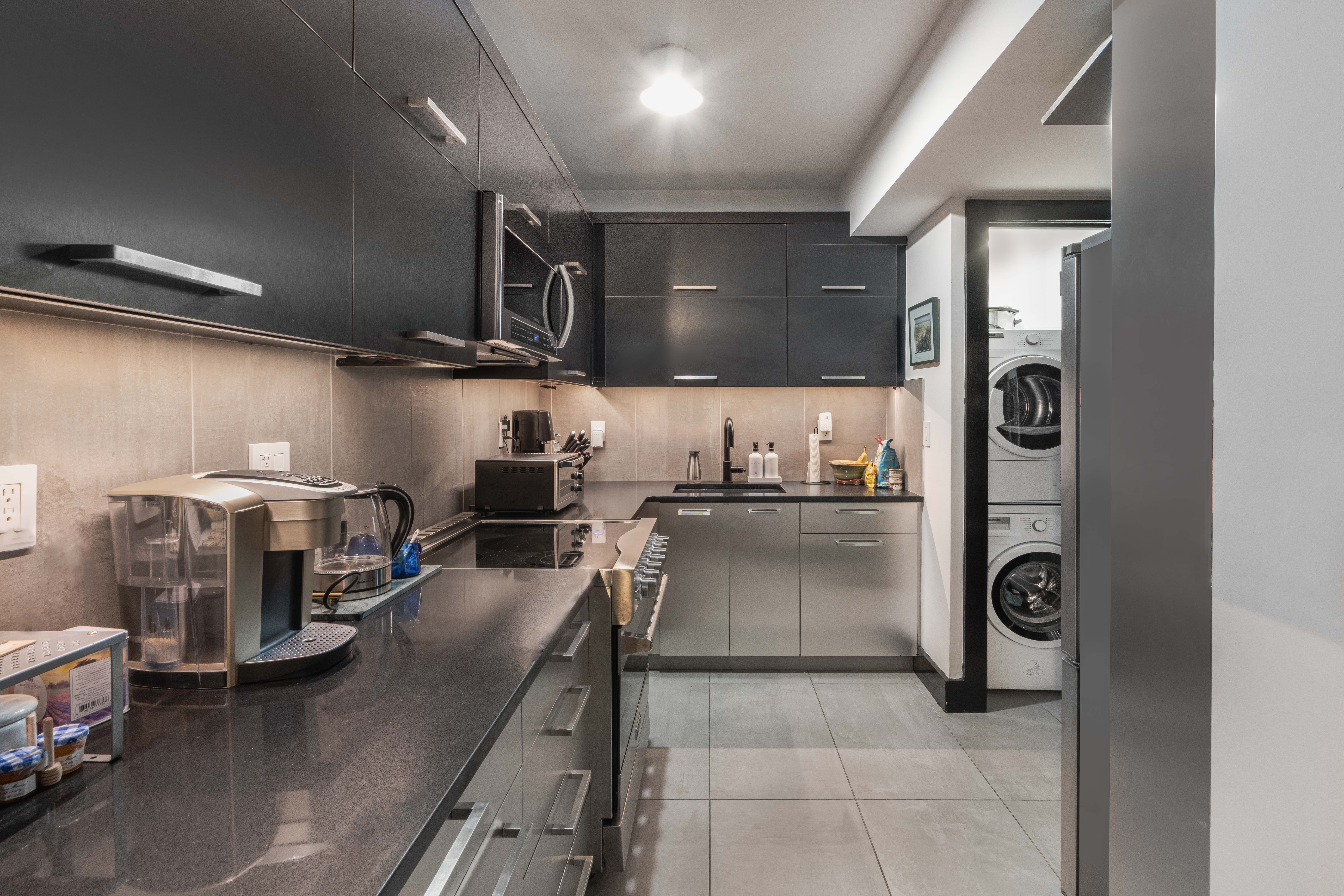 25 Monroe Place, Unit 1C Brooklyn, NY 11201 - Photo 4 of 14 a kitchen with refrigerator and microwave
