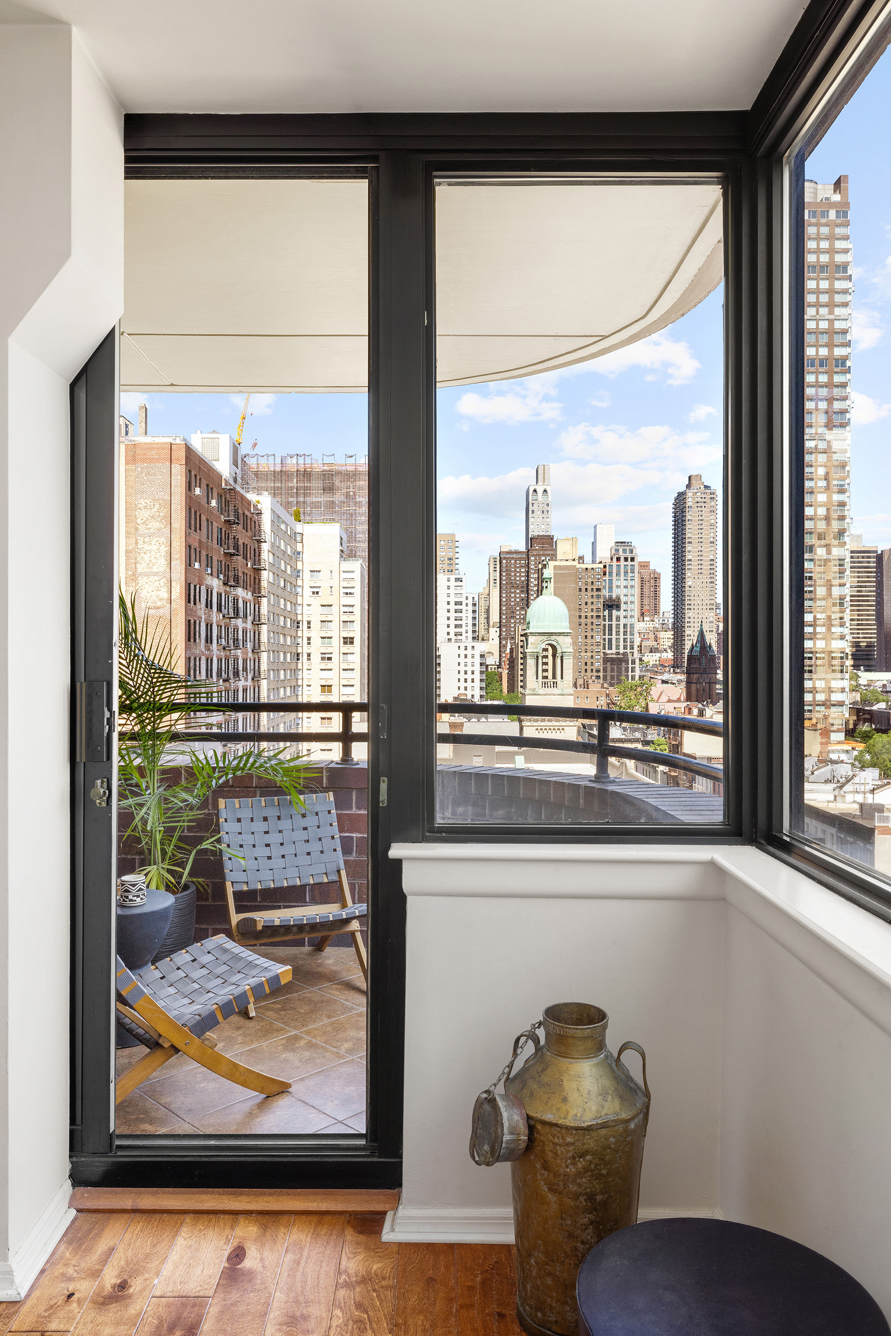 455 East 86th Street, Unit 11A Manhattan, NY 10028 - Photo 3 of 11 a living room with a large window and couch