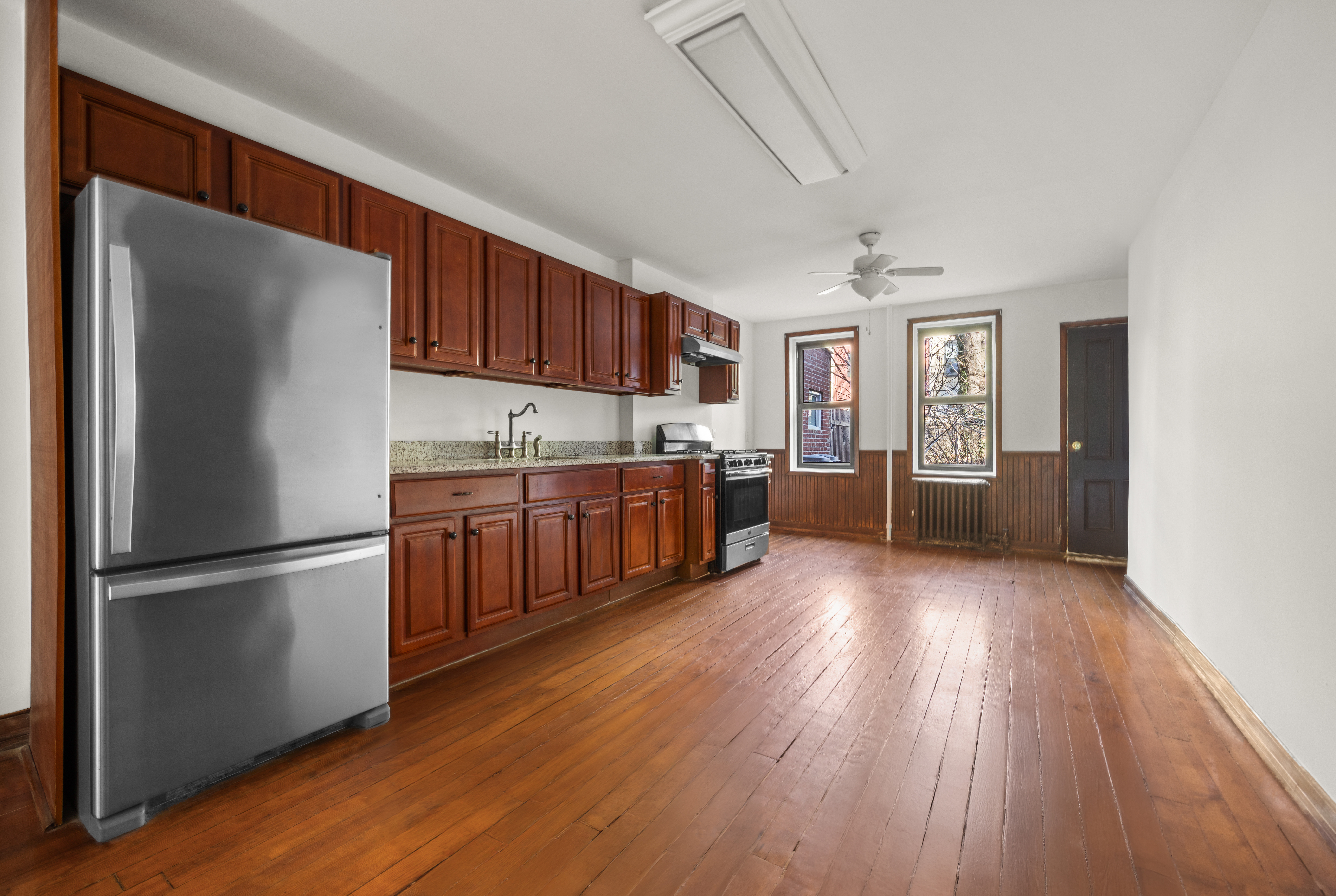 415 5th Street, Unit 1 Brooklyn, NY 11215 - Photo 9 of 14 a kitchen with stainless steel appliances granite countertop a refrigerator a sink dishwasher a stove and a wooden floors