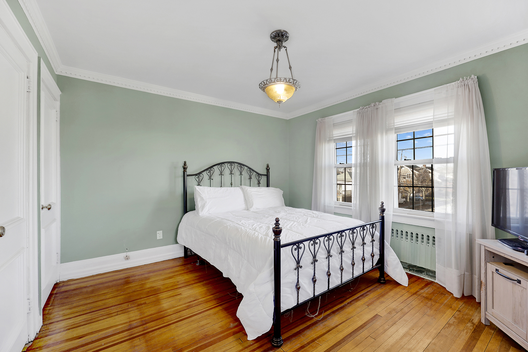 142-15 Newport Avenue Queens, NY 11694 - Photo 28 of 72 a bedroom with a bed and a window
