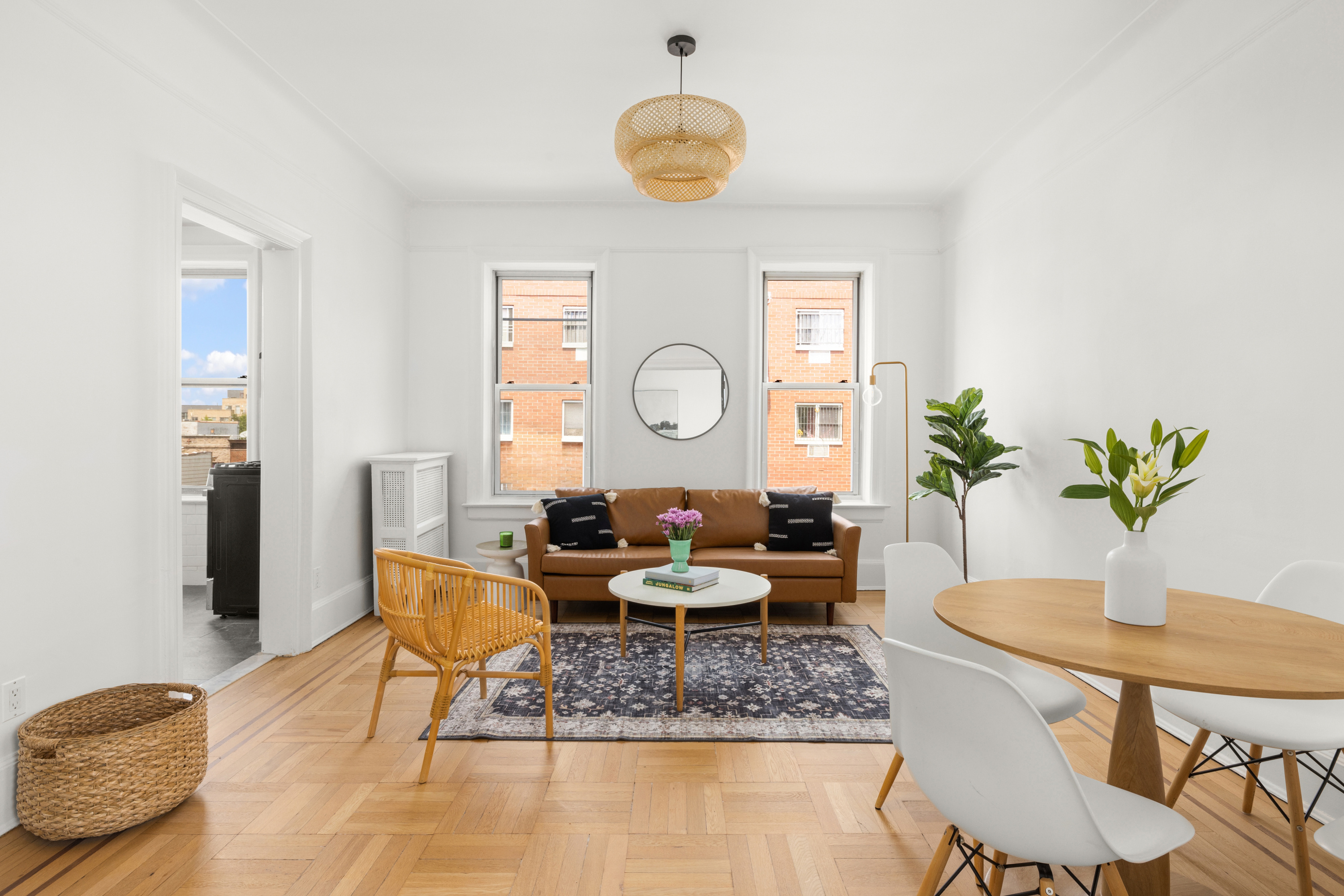 759 42nd Street, Unit 14 Brooklyn, NY 11232 - Photo 2 of 9 a living room with fireplace furniture and a large window