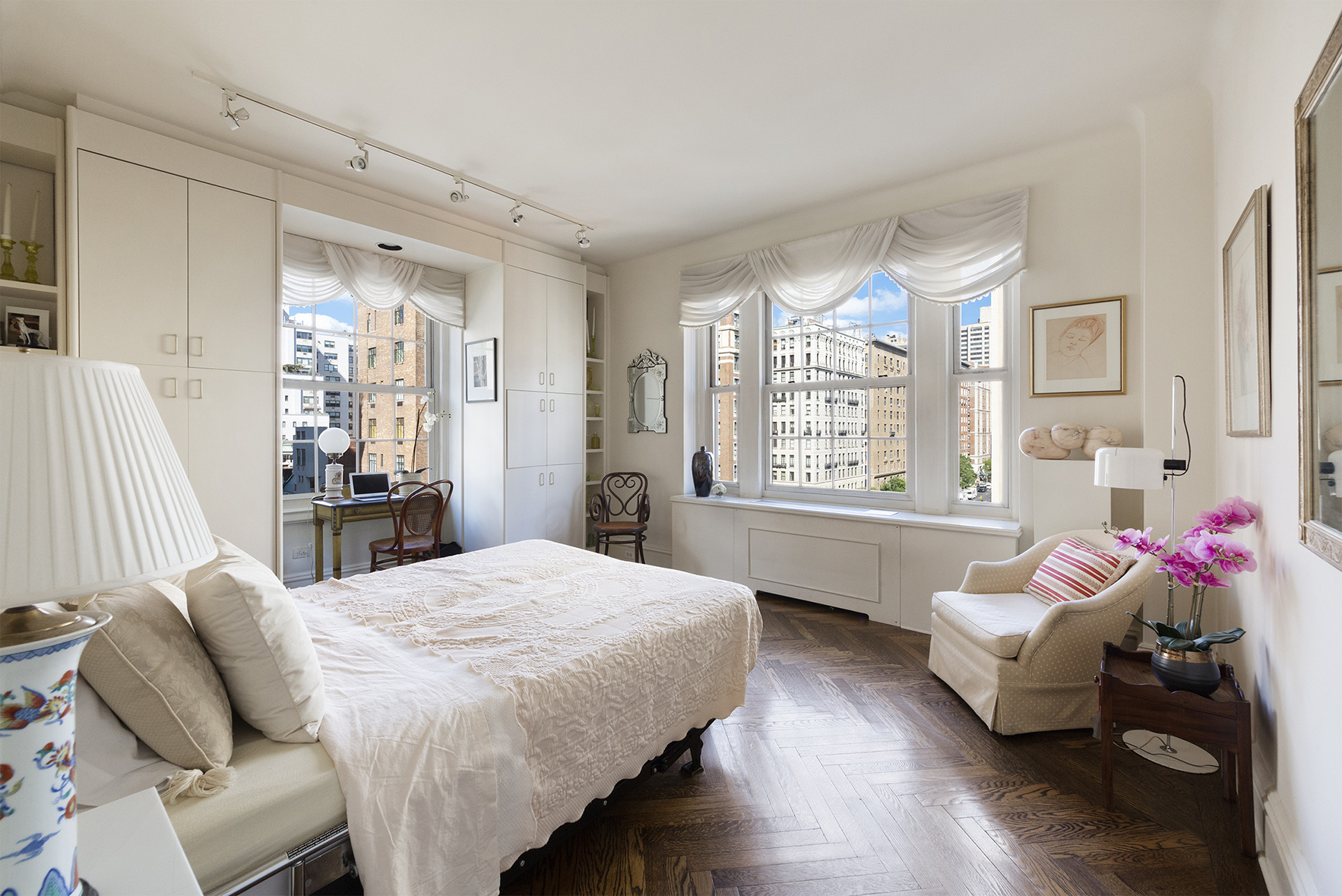 815 Park Avenue, Unit 8A Manhattan, NY 10021 - Photo 4 of 8 a living room with furniture and a large window