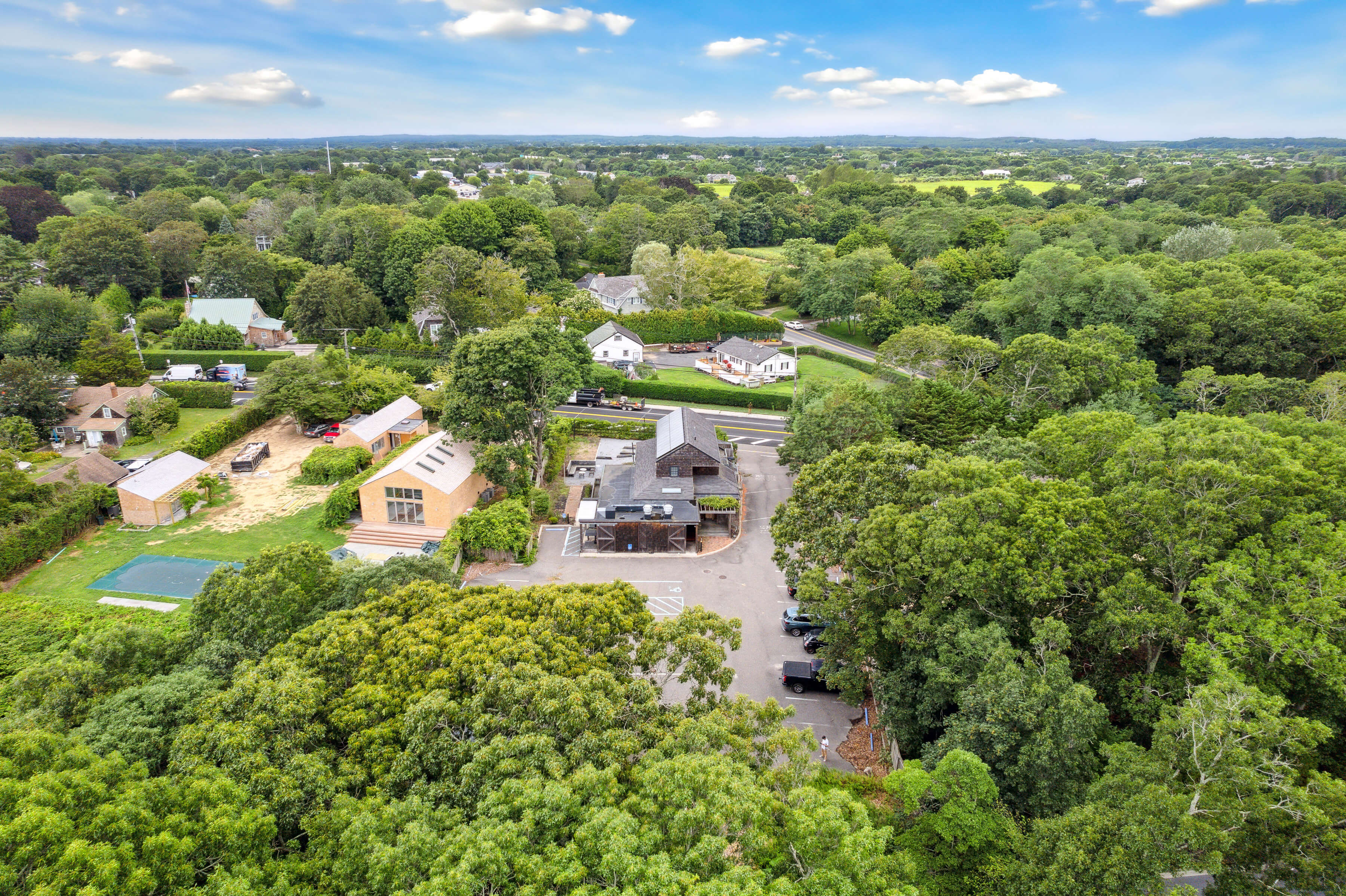 203 Bridgehampton-Sag Harbor Turnpike Bridgehampton, NY 11932 - Photo 11 of 14 an aerial view of residential houses with outdoor space and trees