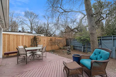 a view of a patio with couple of chairs