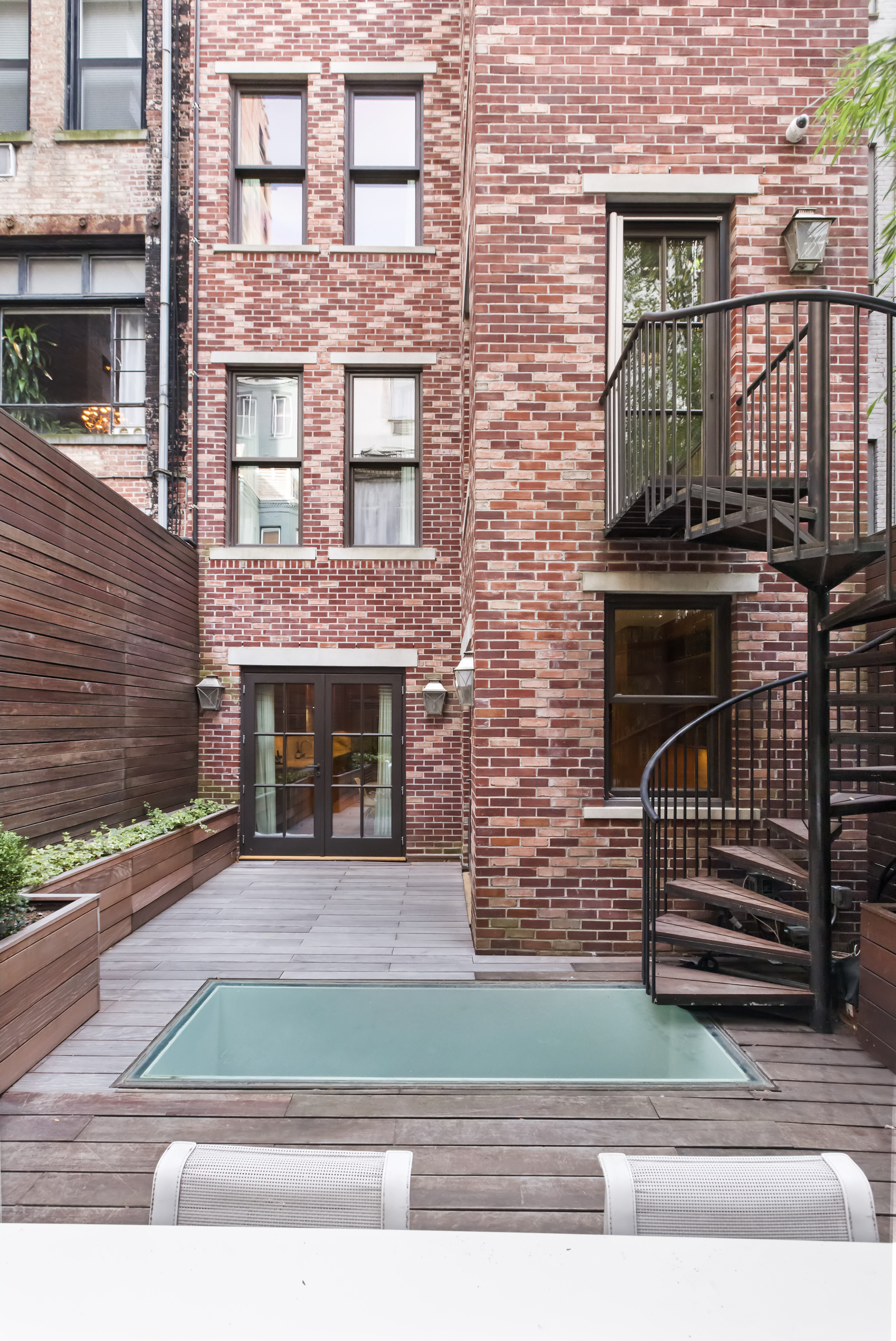 45 East 74th Street Manhattan, NY 10021 - Photo 32 of 33 a front view of a house with garage