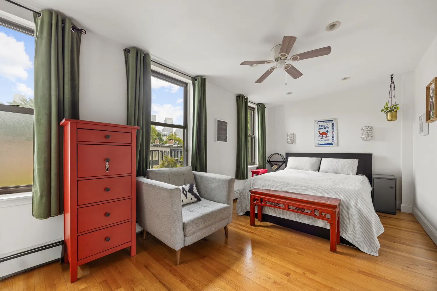 a bedroom with a bed and a dresser