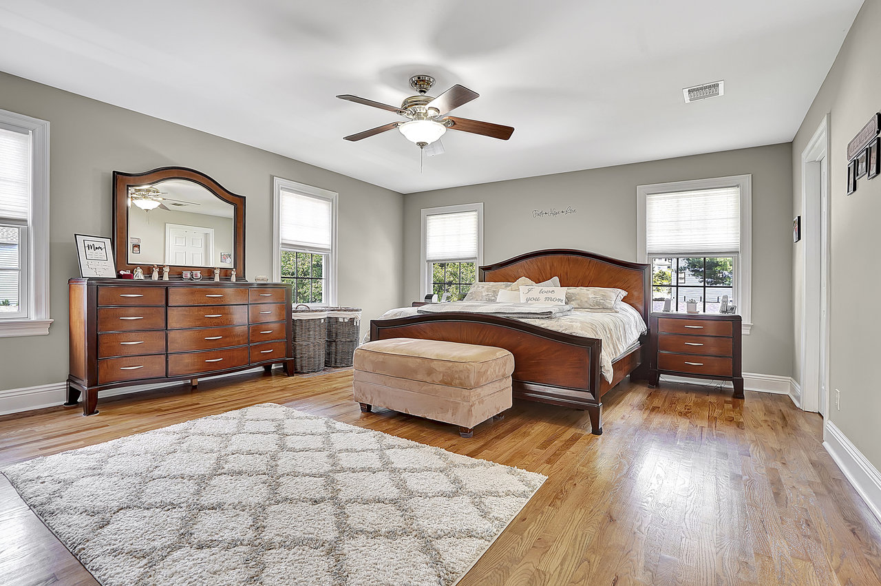 266 Feronia Way Rutherford, NJ 07070 - Photo 18 of 41 a bedroom with a large bed and a chandelier