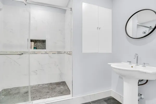 a bathroom with a sink and a mirror